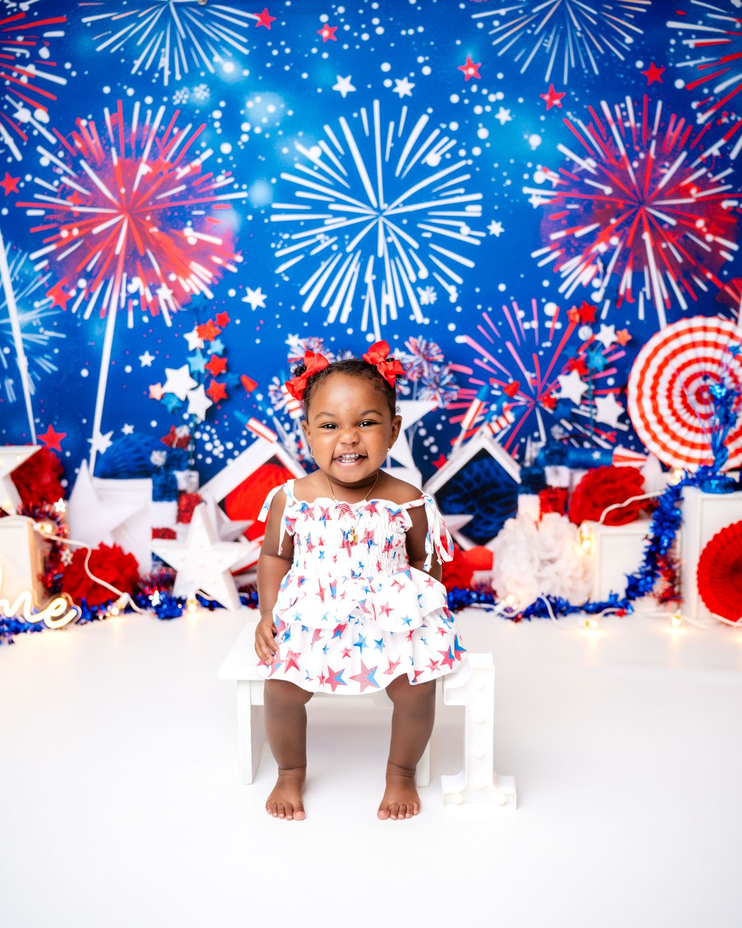Patriotic themed photo with fireworks background and cityscape silhouette.