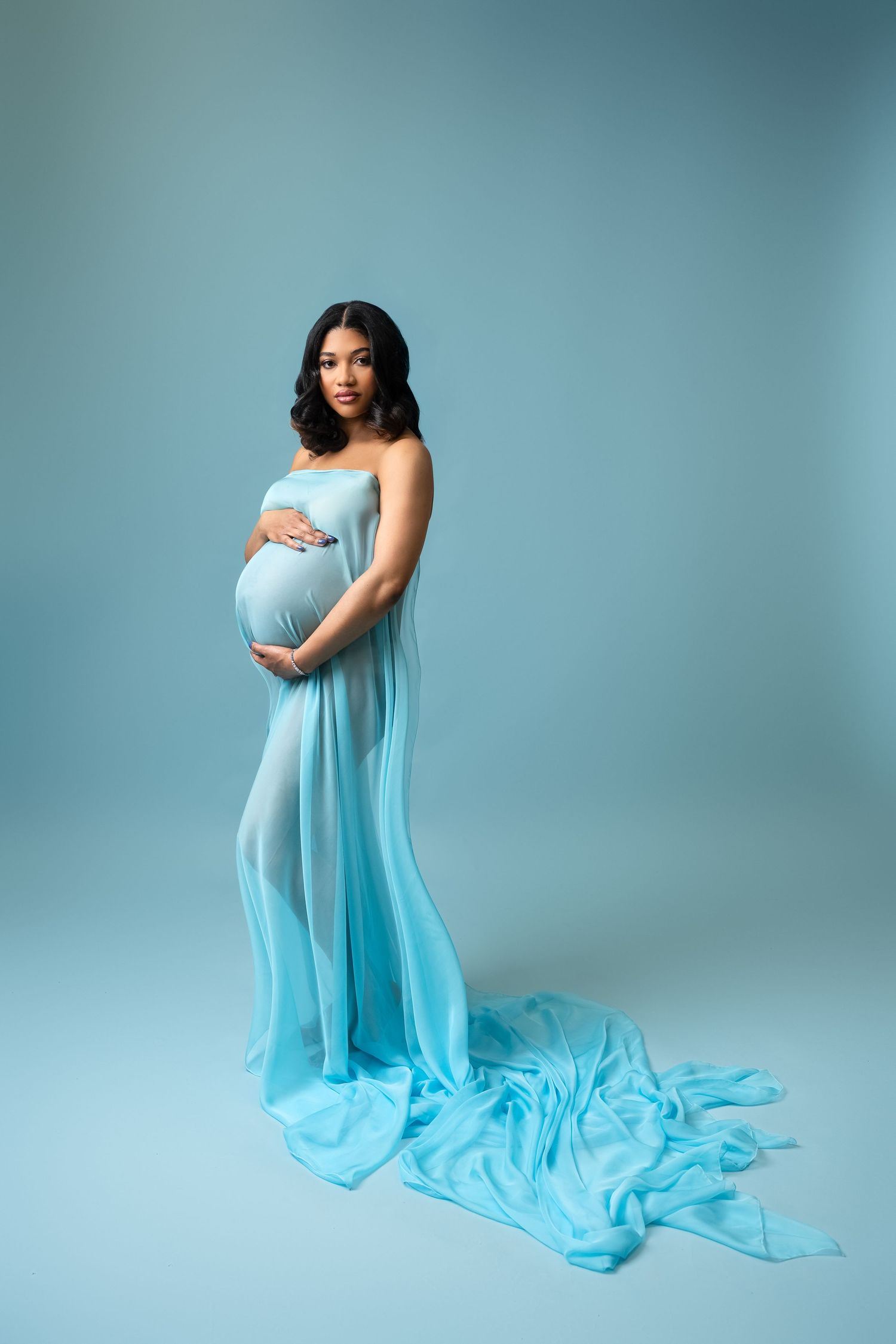 Metro Detroit maternity photographer capturing an expecting mother in studio