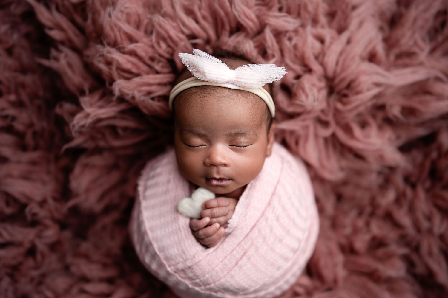 Metro Detroit newborn photographer capturing a peaceful newborn portrait in studio