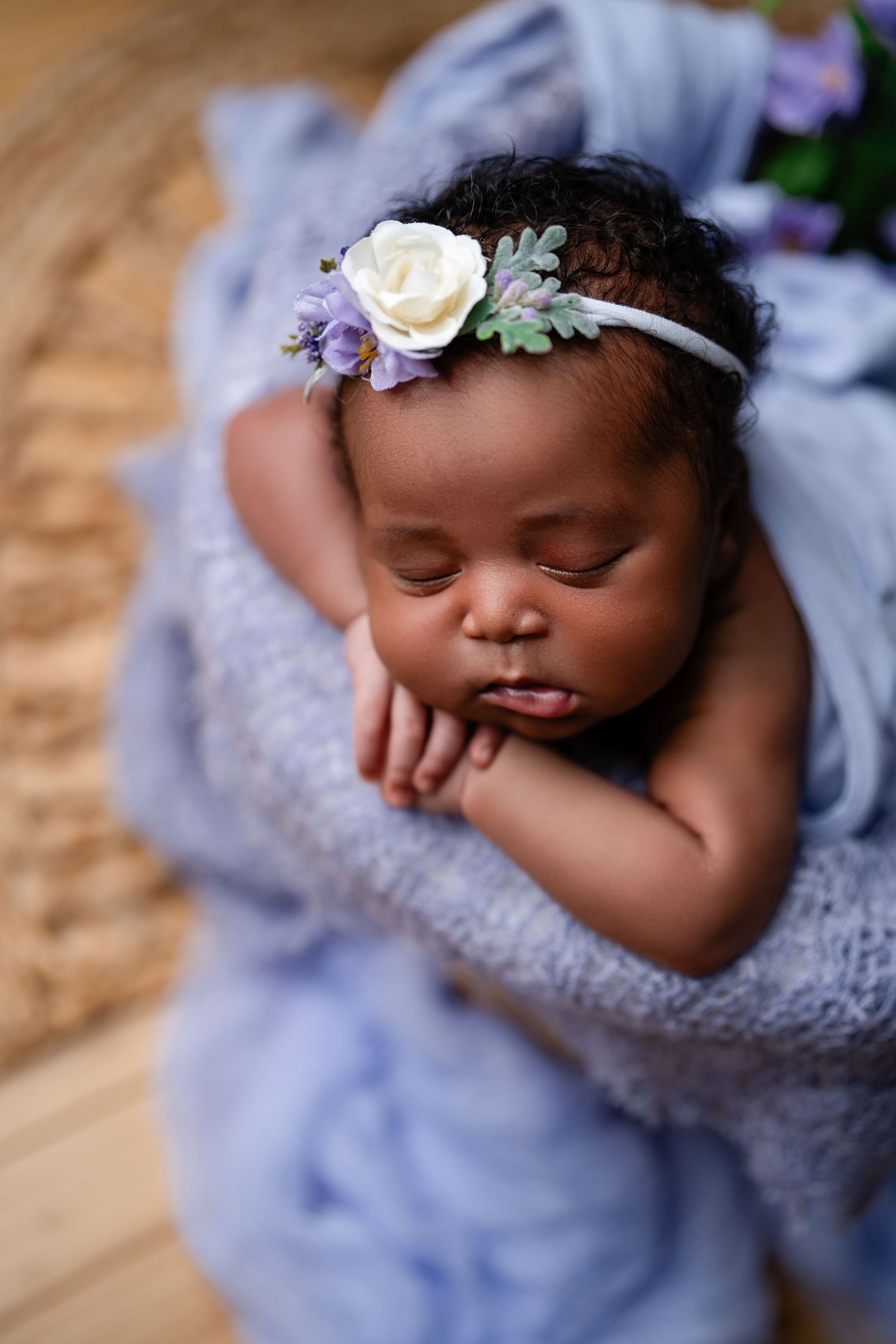 Metro Detroit newborn photographer capturing a peaceful newborn portrait in studio