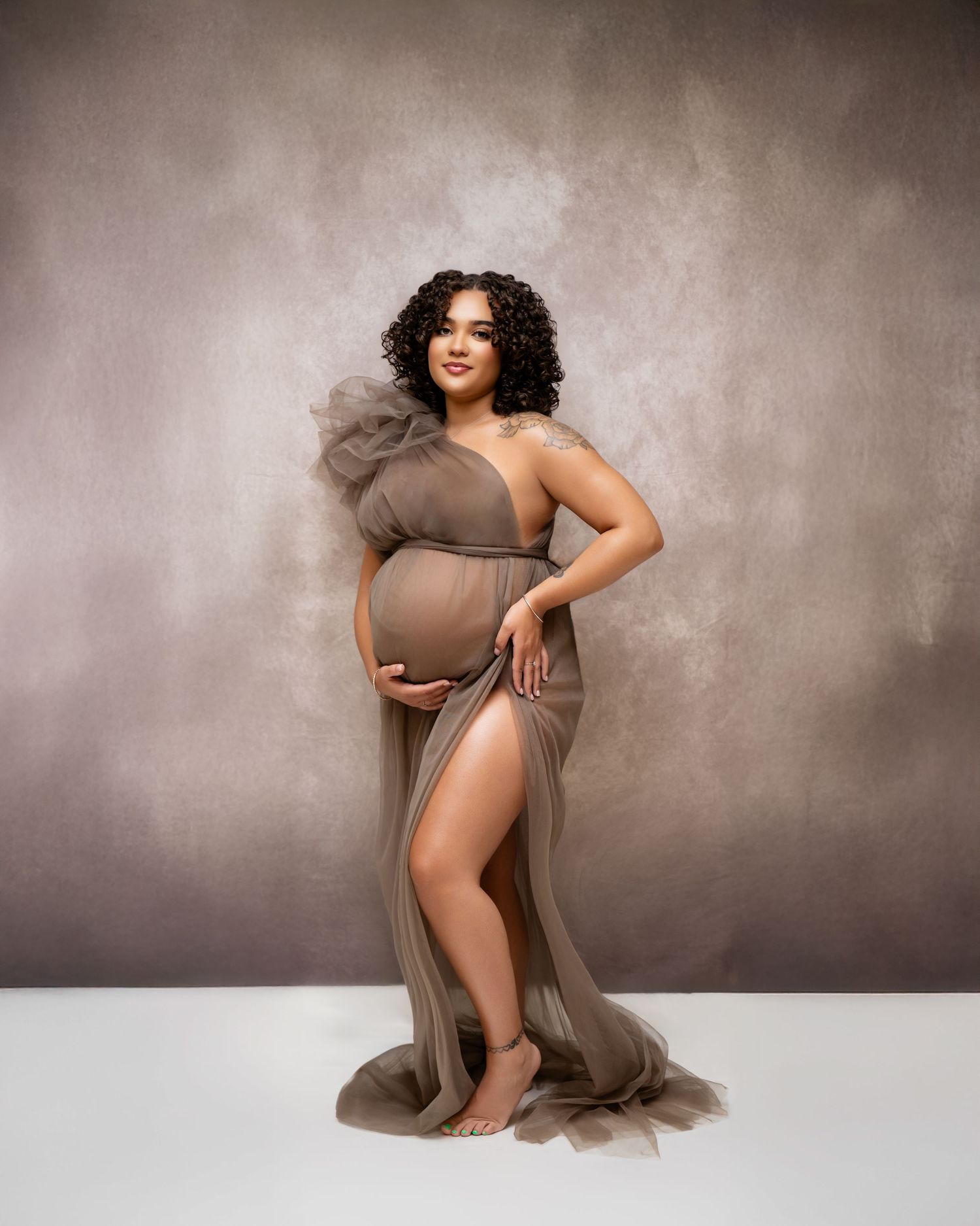 Metro Detroit maternity photographer capturing an expecting mother in studio