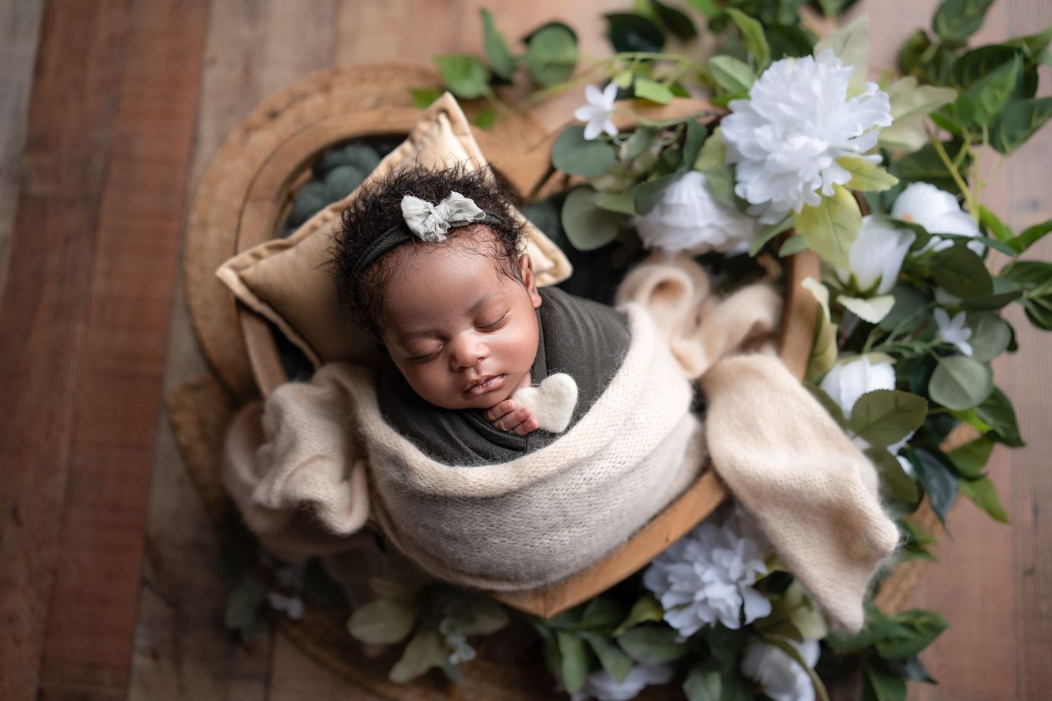 Metro Detroit newborn photographer capturing a peaceful newborn portrait in studio