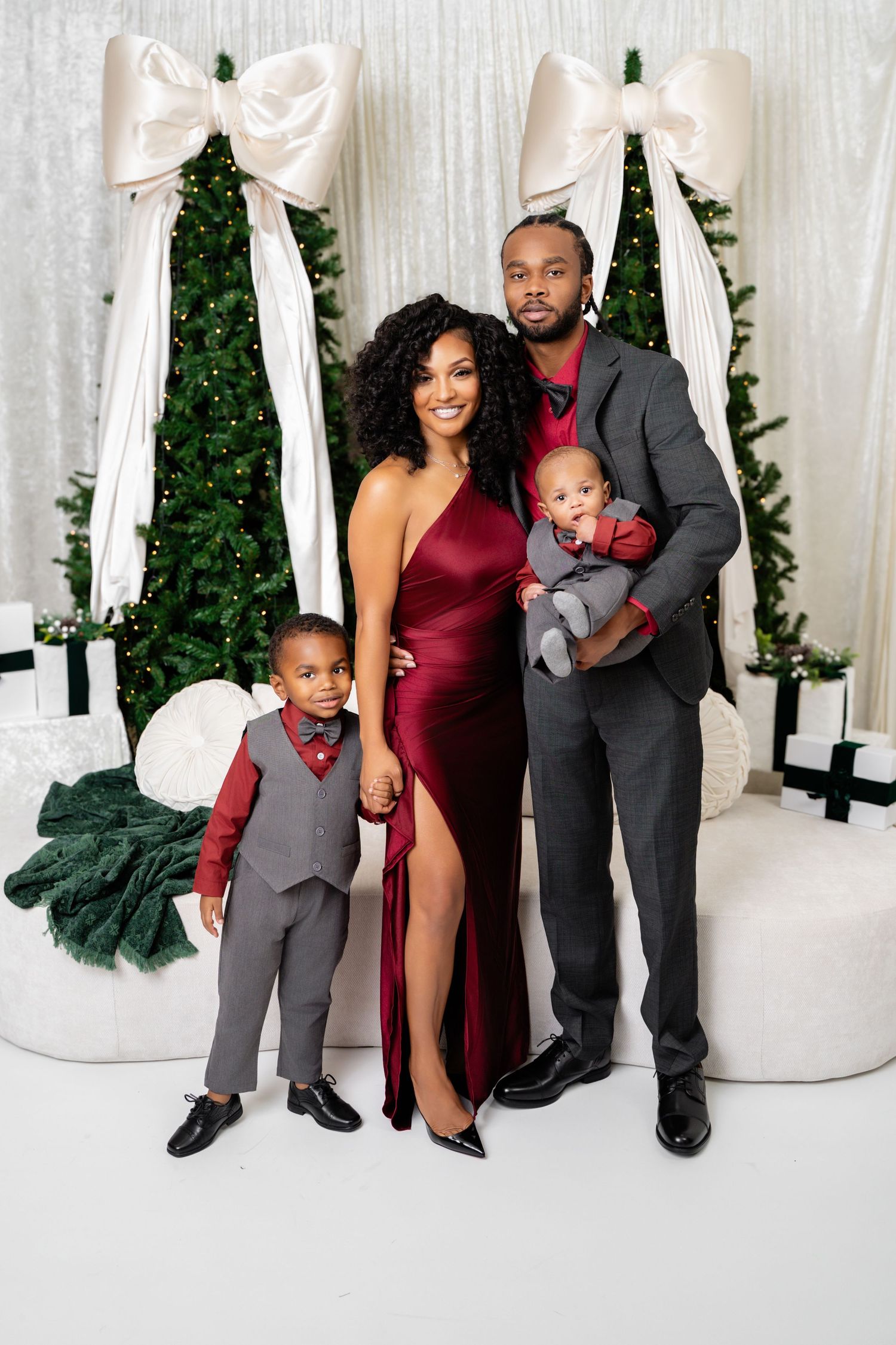 Metro Detroit family photographer capturing a Family poses together in formal attire