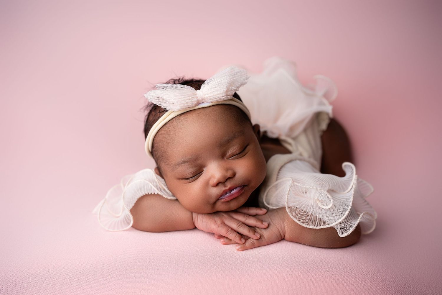 Metro Detroit newborn photographer capturing a peaceful newborn portrait in studio