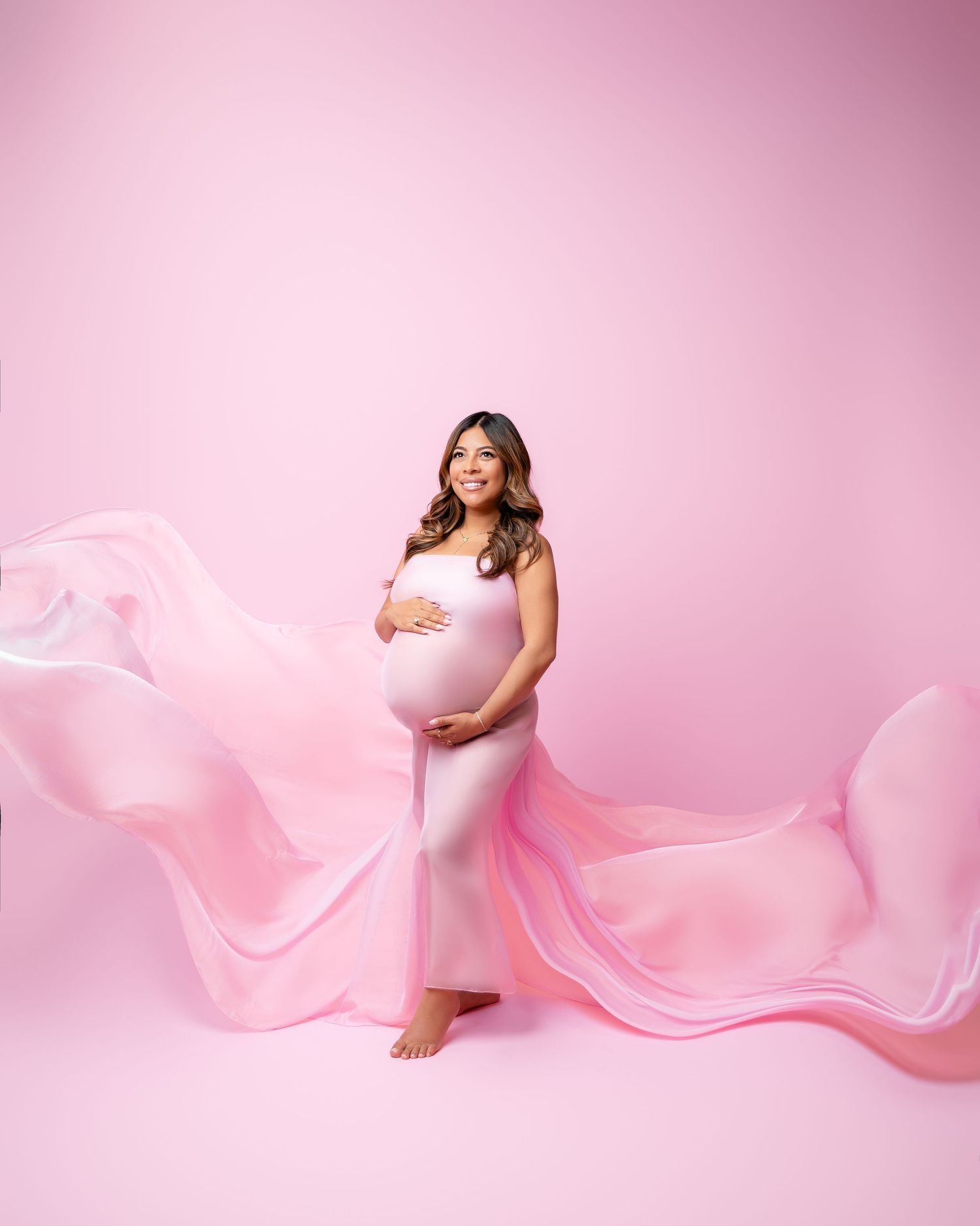 Metro Detroit maternity photographer capturing an expecting mother in studio