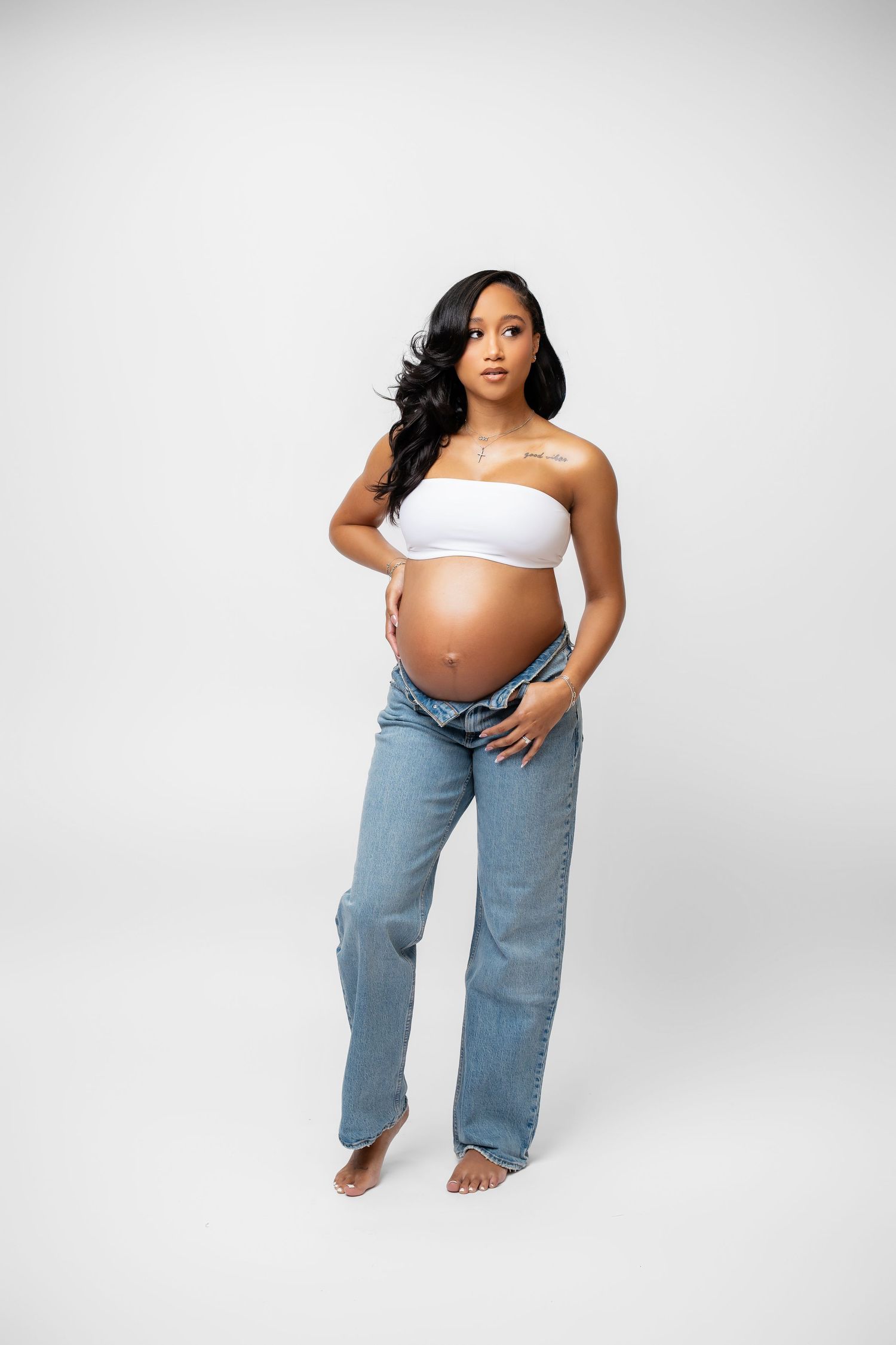 Metro Detroit maternity photographer capturing an expecting mother in studio
