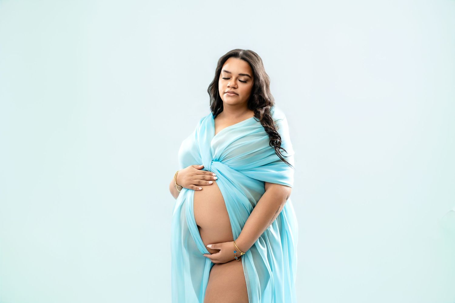 Metro Detroit maternity photographer capturing an expecting mother in studio
