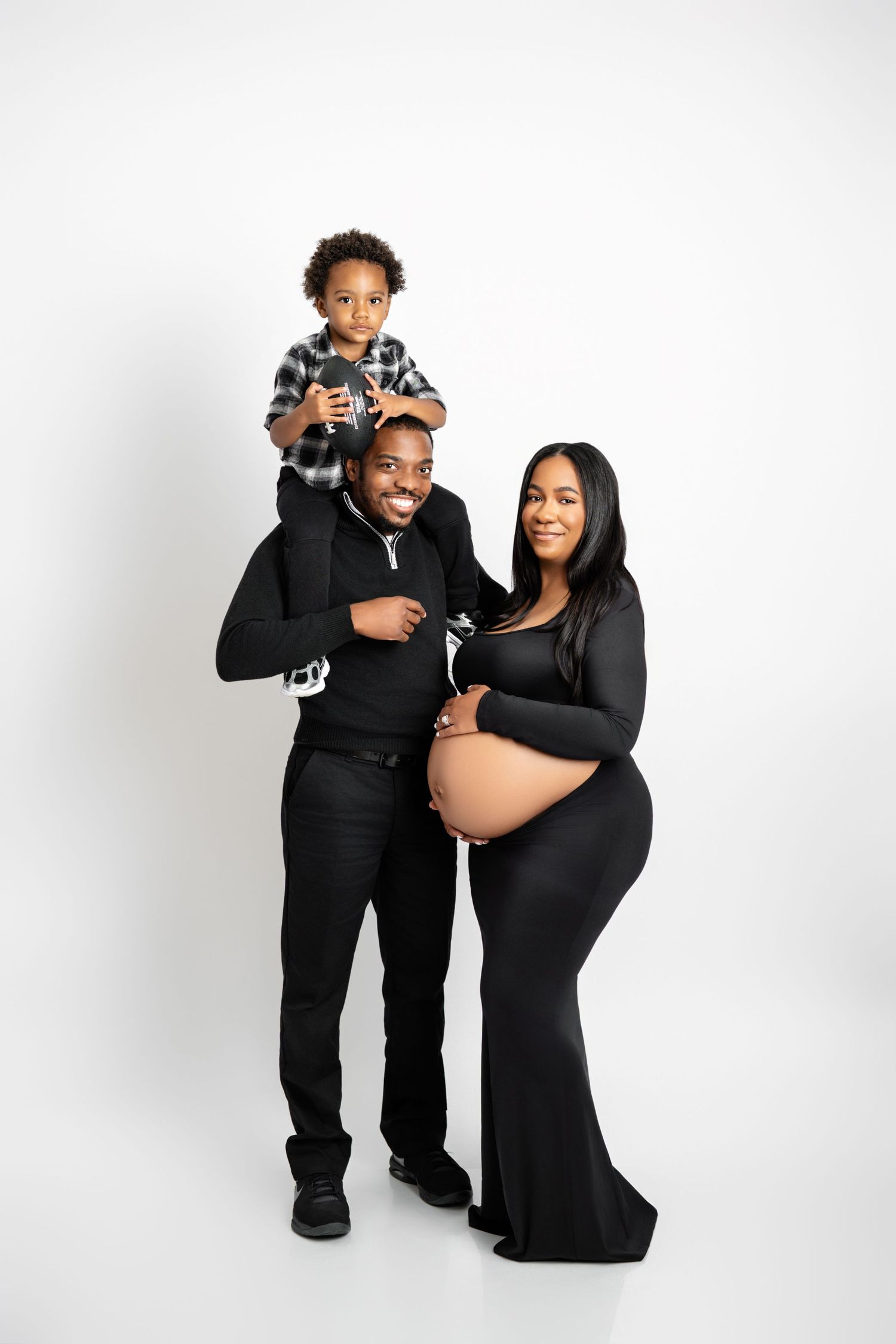 Metro Detroit maternity photographer capturing an expecting mother and family in studio