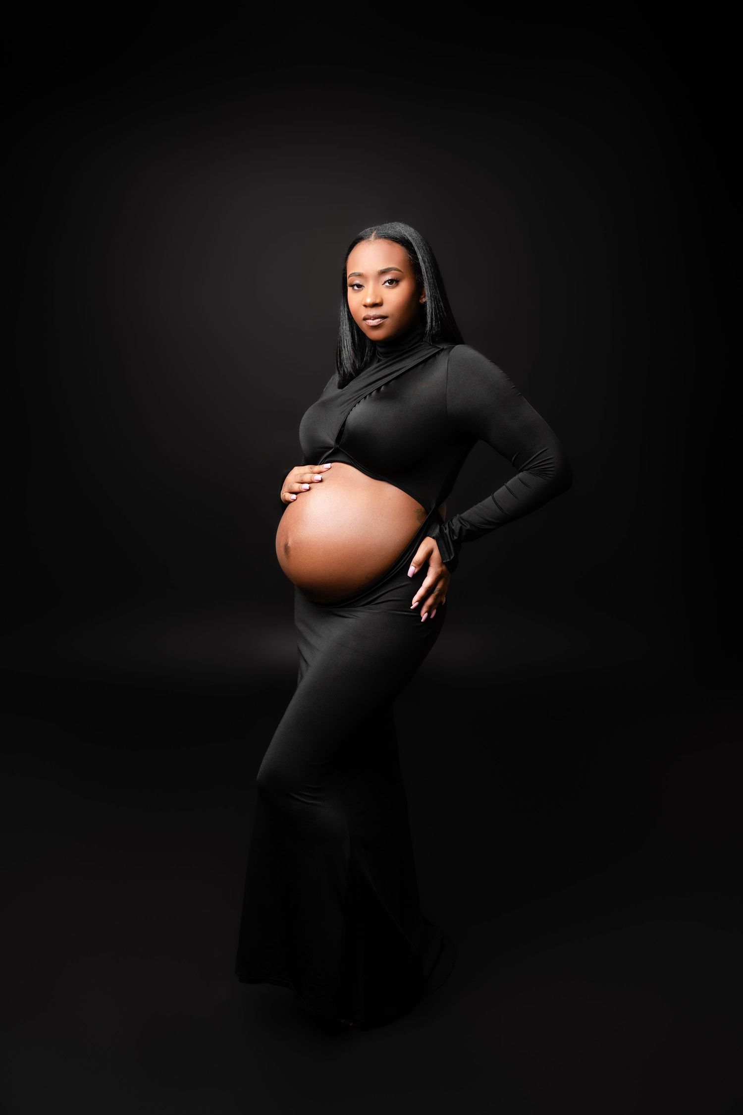 Metro Detroit maternity photographer capturing an expecting mother in studio
