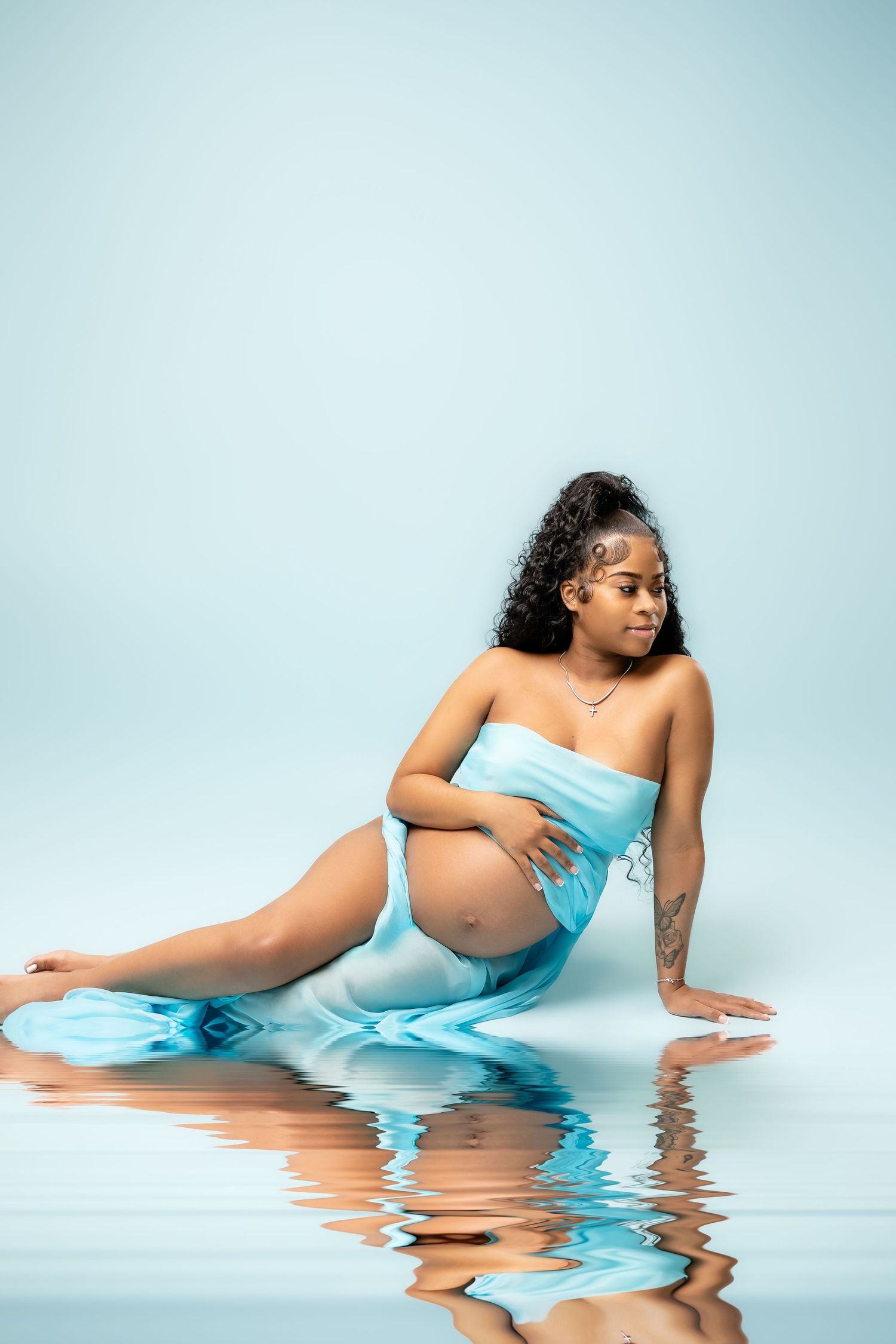 Metro Detroit maternity photographer capturing an expecting mother in studio
