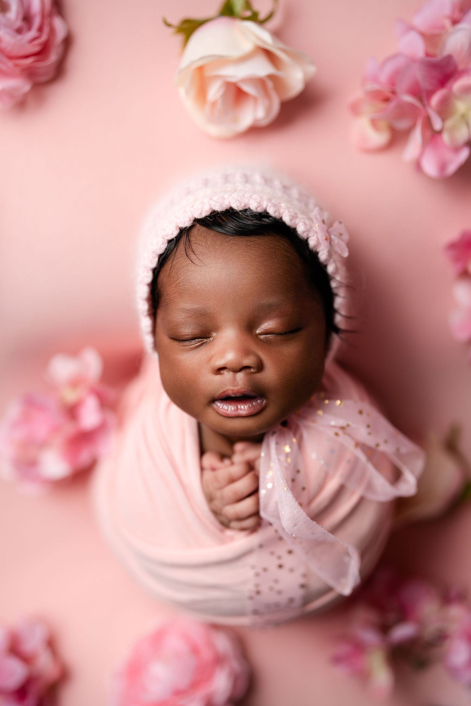 Metro Detroit newborn photographer capturing a peaceful newborn portrait in studio