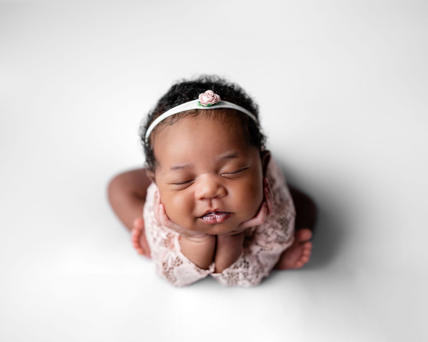 Metro Detroit newborn photographer capturing a peaceful newborn portrait in studio