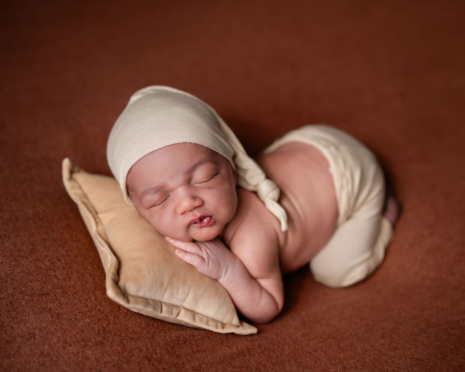 Metro Detroit newborn photographer capturing a peaceful newborn portrait in studio