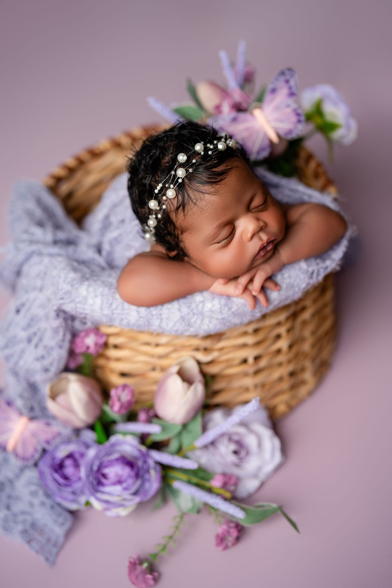 Metro Detroit newborn photographer capturing a peaceful newborn portrait in studio