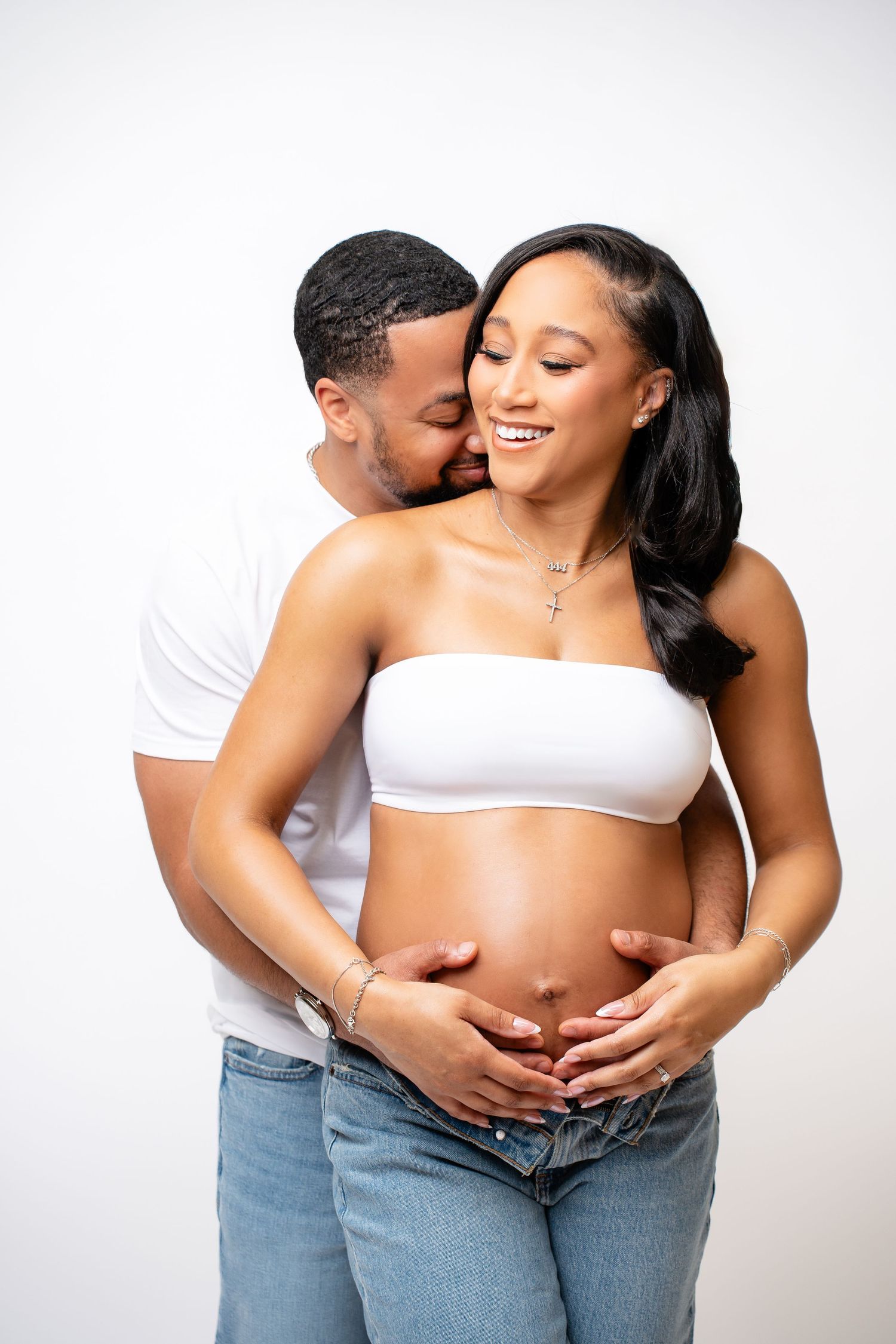 Metro Detroit maternity photographer capturing an expecting couple in studio