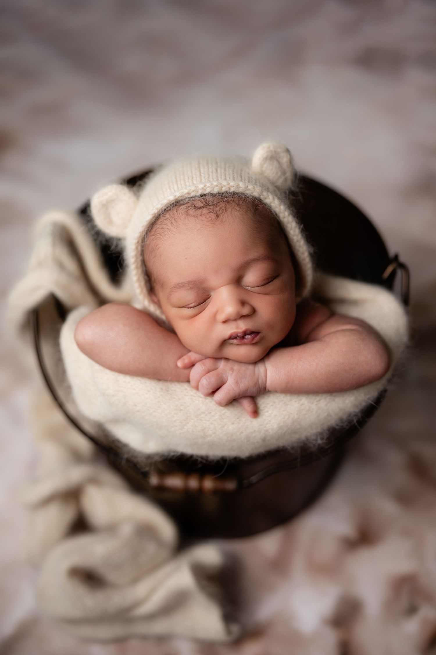 Metro Detroit newborn photographer capturing a peaceful newborn portrait in studio