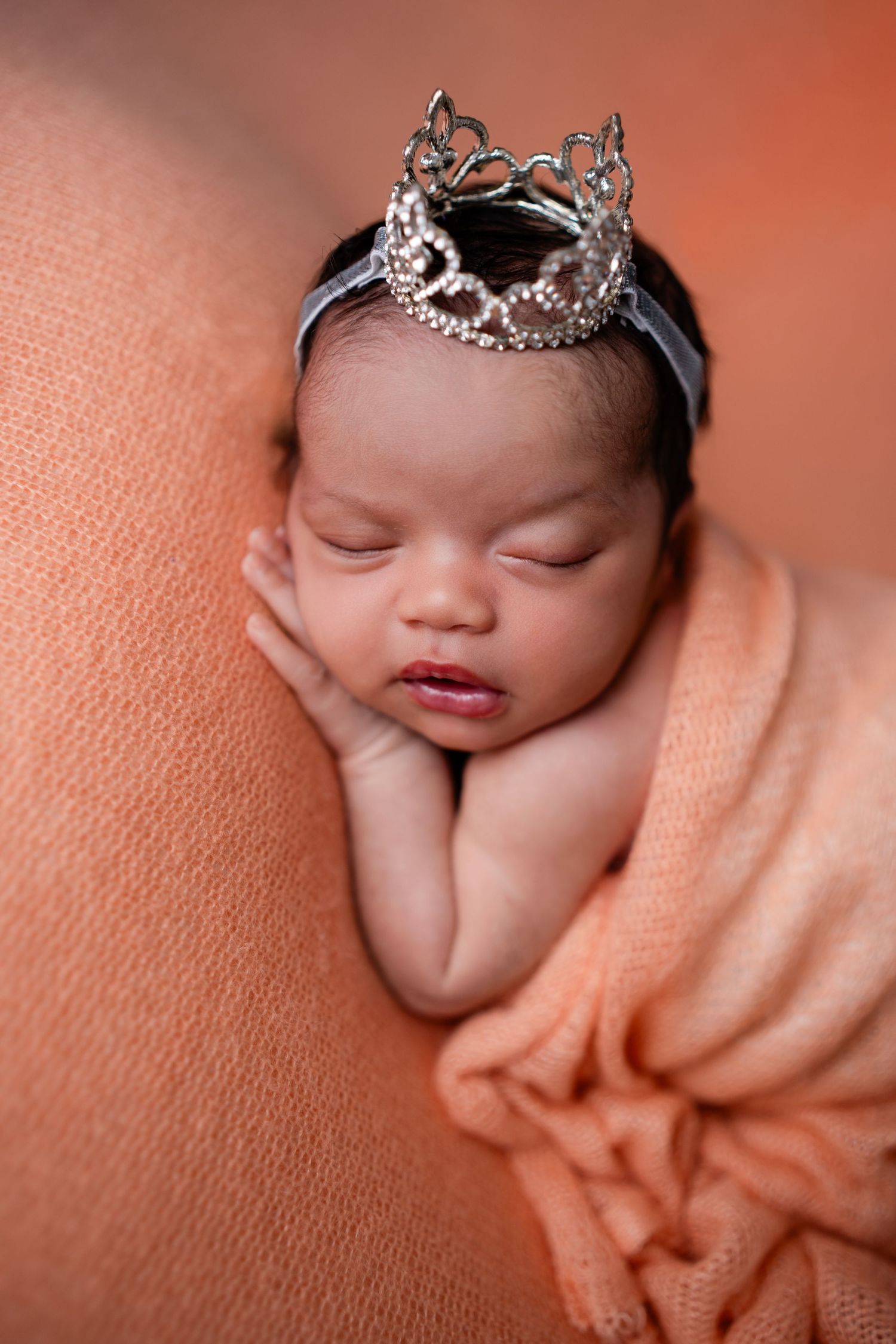 Metro Detroit newborn photographer capturing a peaceful newborn portrait in studio
