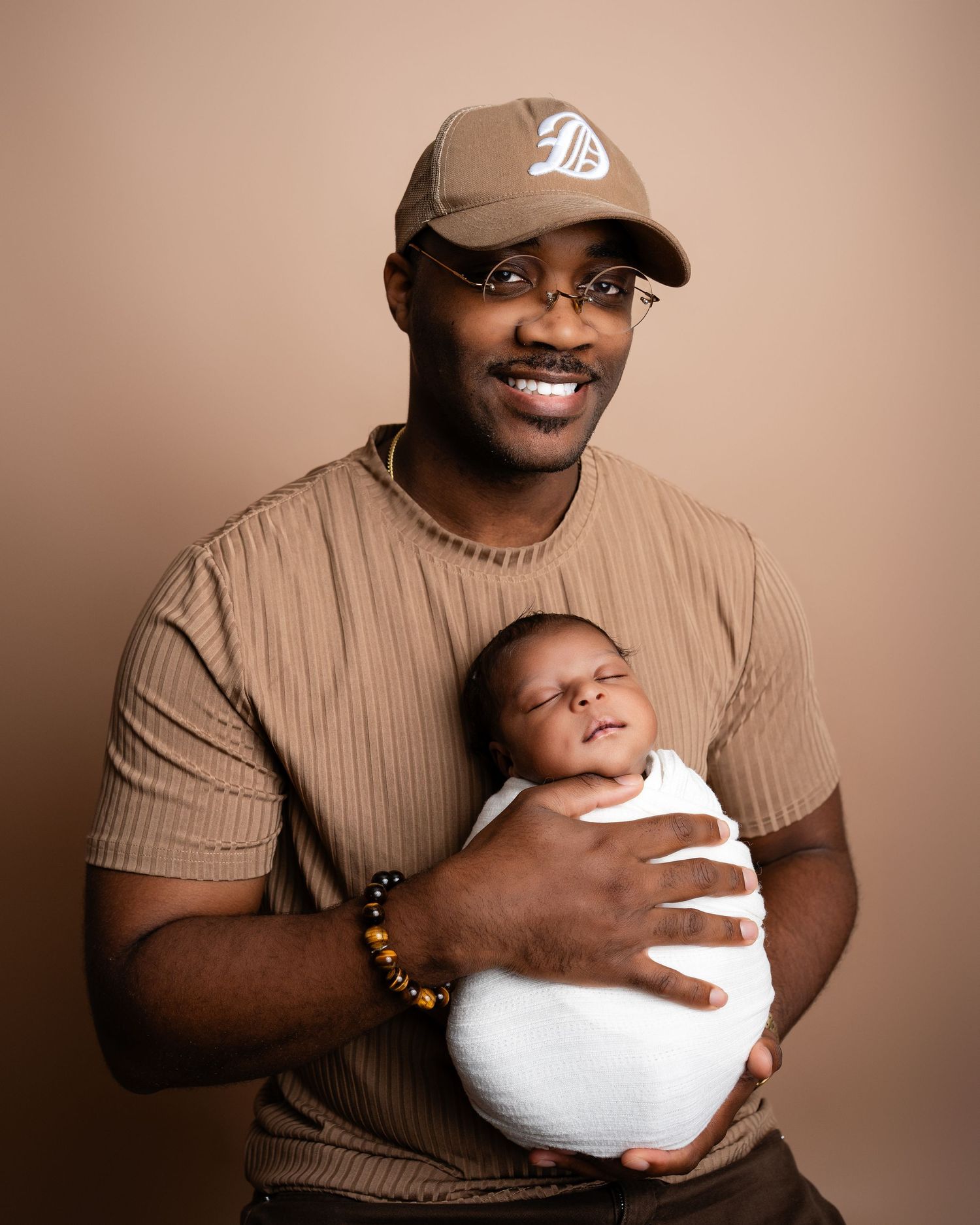 Metro Detroit newborn photographer capturing a peaceful newborn portrait in studio