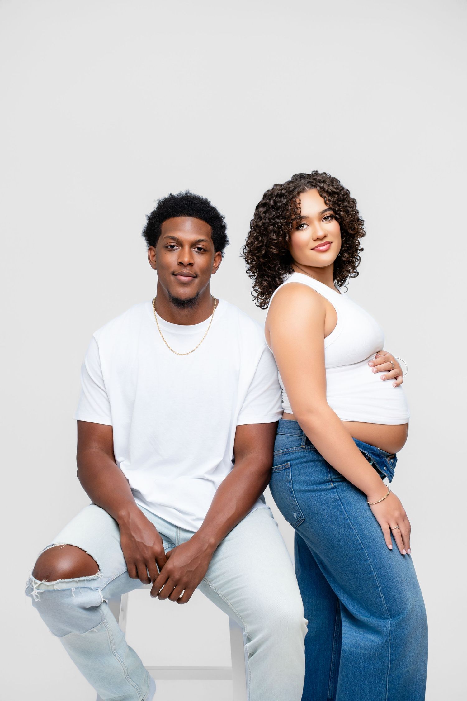 Metro Detroit maternity photographer capturing an expecting mother in studio