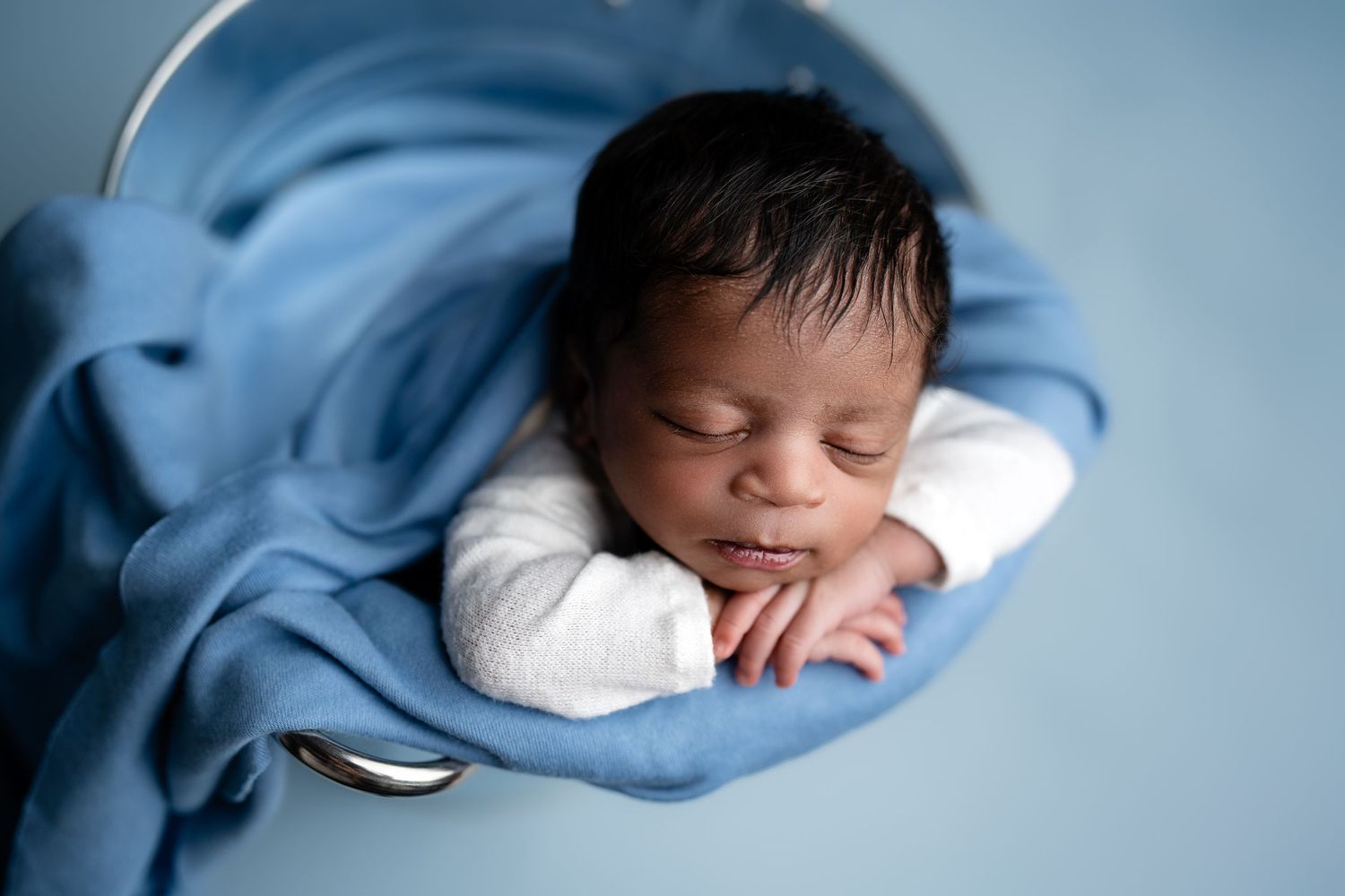 Metro Detroit newborn photographer capturing a peaceful newborn portrait in studio