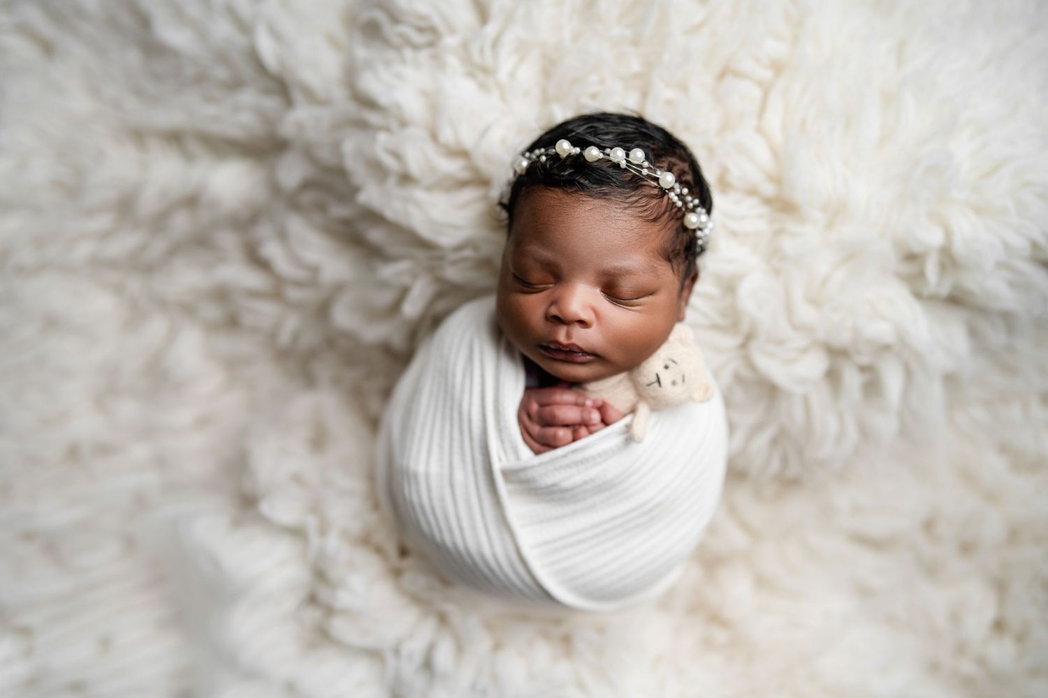 Metro Detroit newborn photographer capturing a peaceful newborn portrait in studio