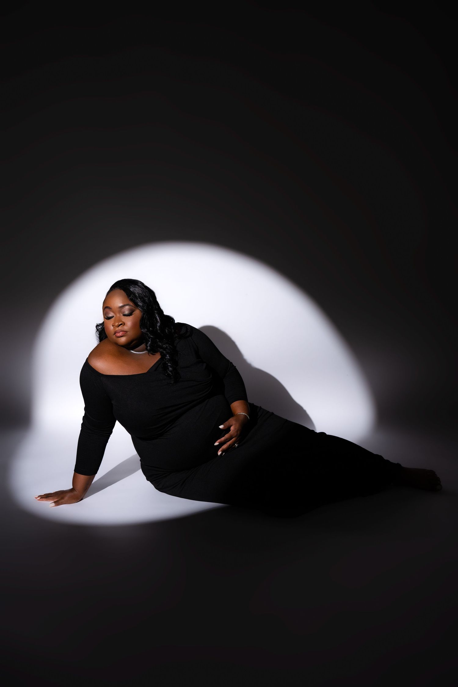 Metro Detroit maternity photographer capturing an expecting mother in studio