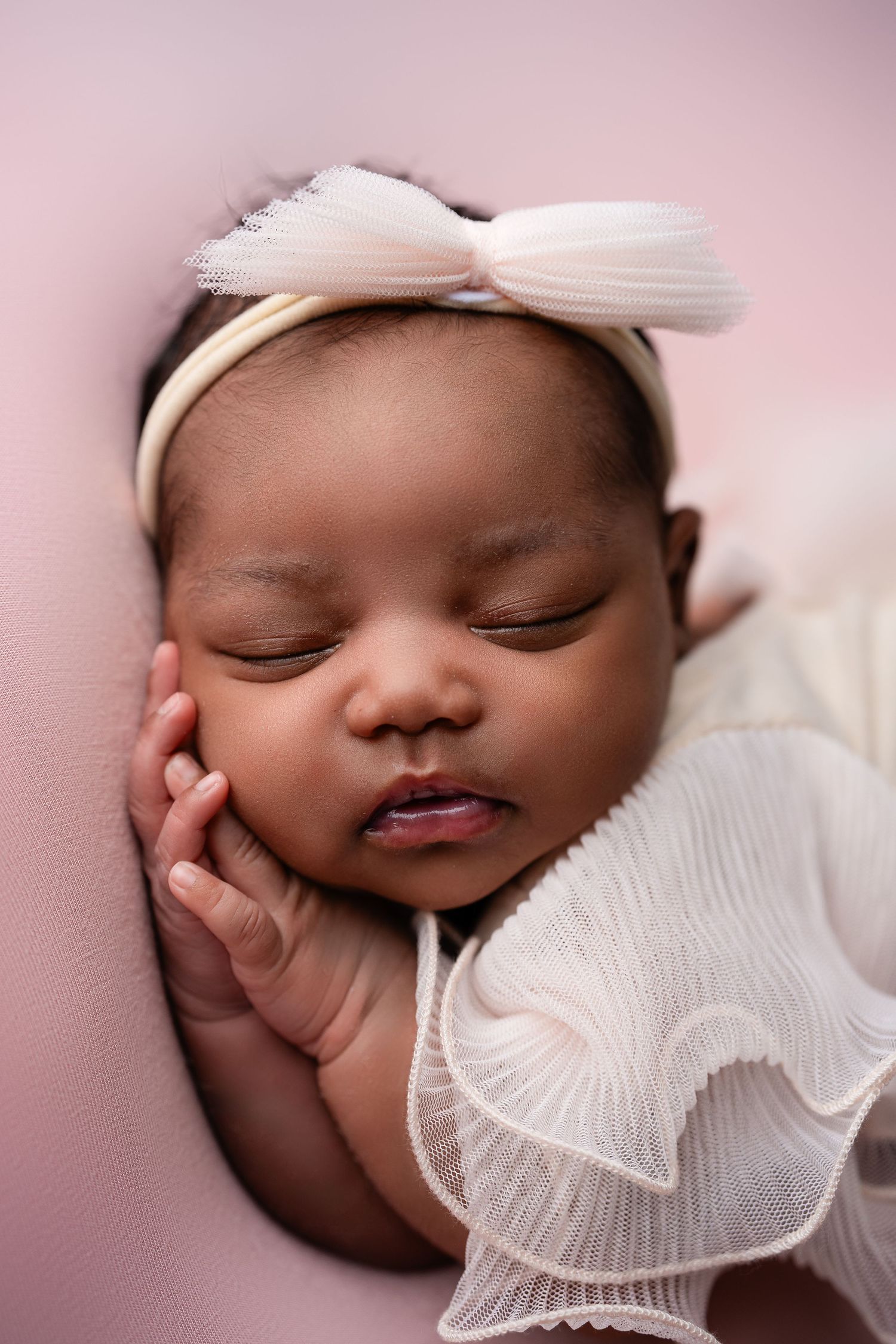 Metro Detroit newborn photographer capturing a peaceful newborn portrait in studio