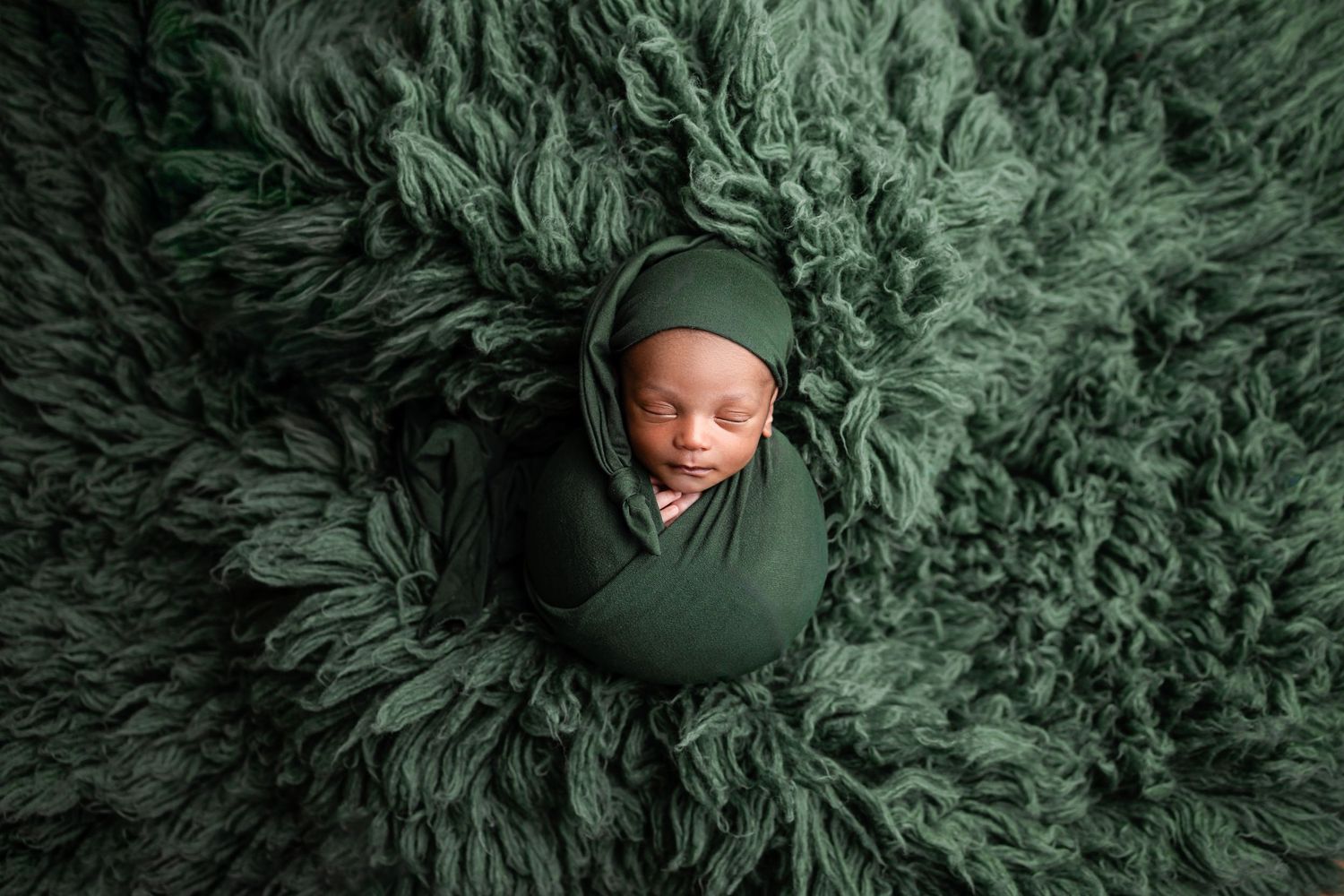 Metro Detroit newborn photographer capturing a peaceful newborn portrait in studio