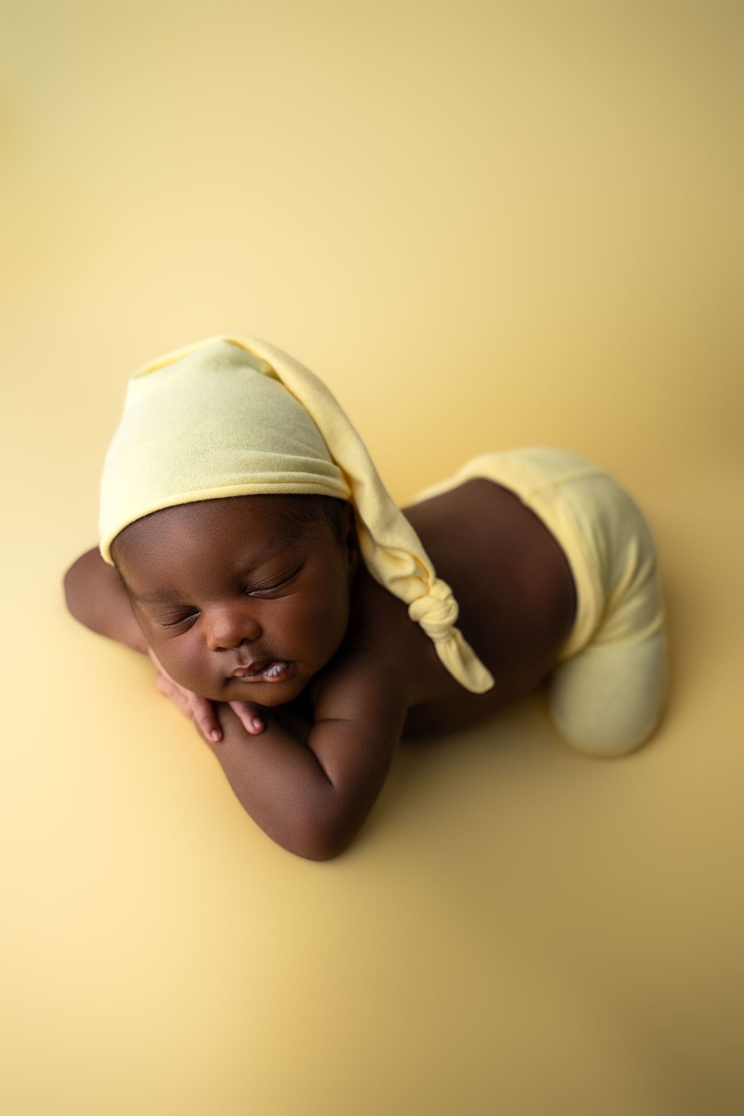 Metro Detroit newborn photographer capturing a peaceful newborn portrait in studio