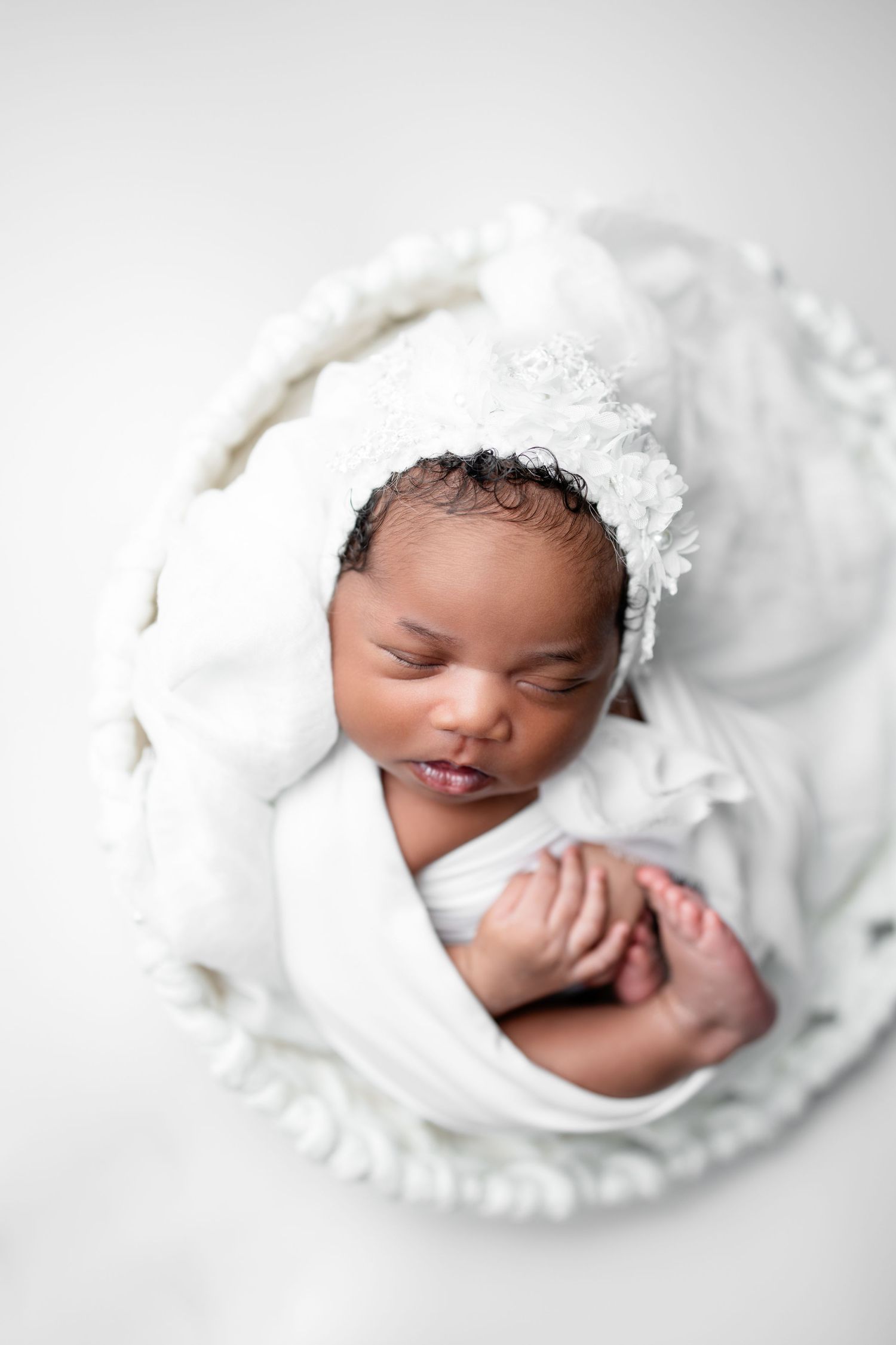 Metro Detroit newborn photographer capturing a peaceful newborn portrait in studio