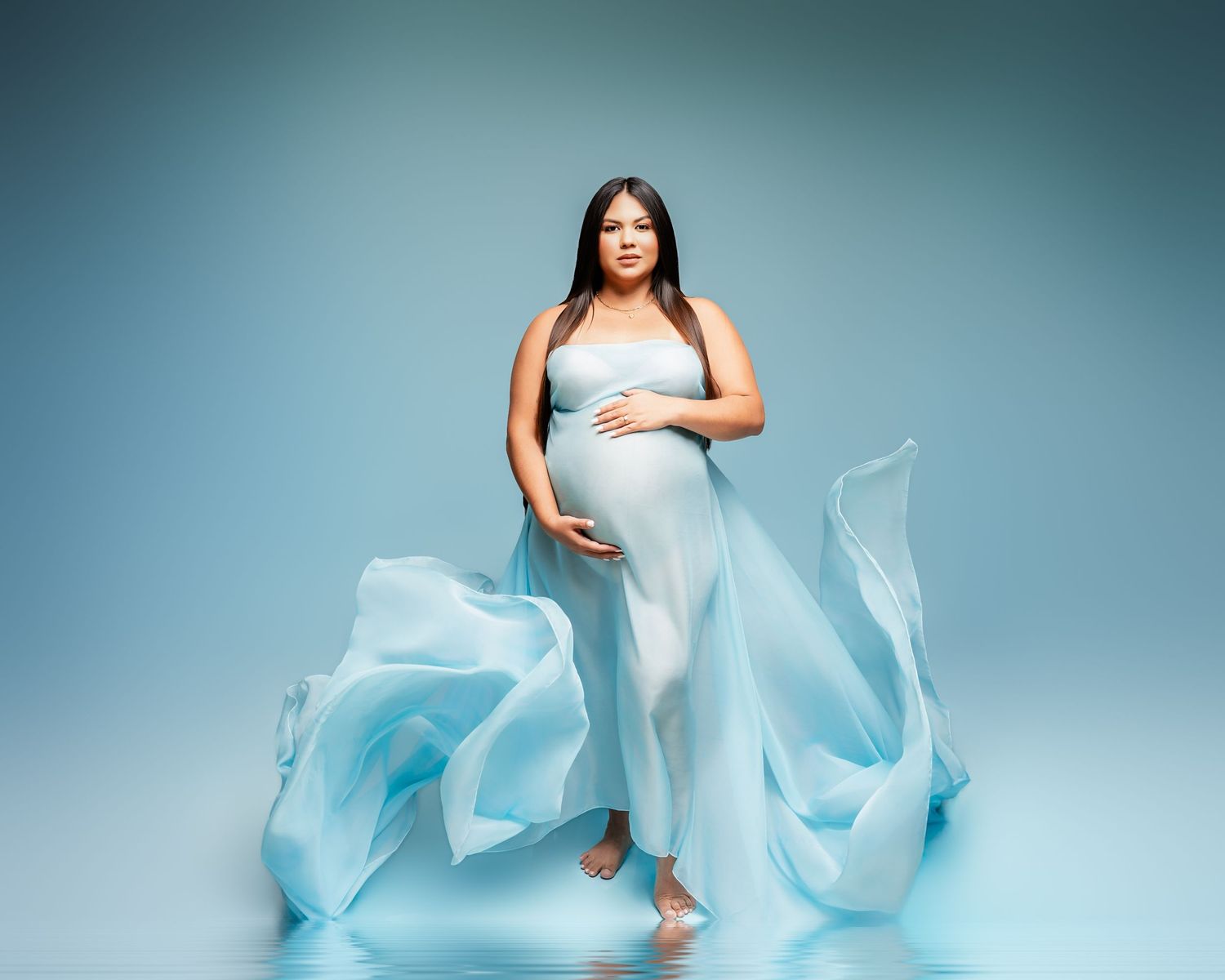 Metro Detroit maternity photographer capturing an expecting mother in studio