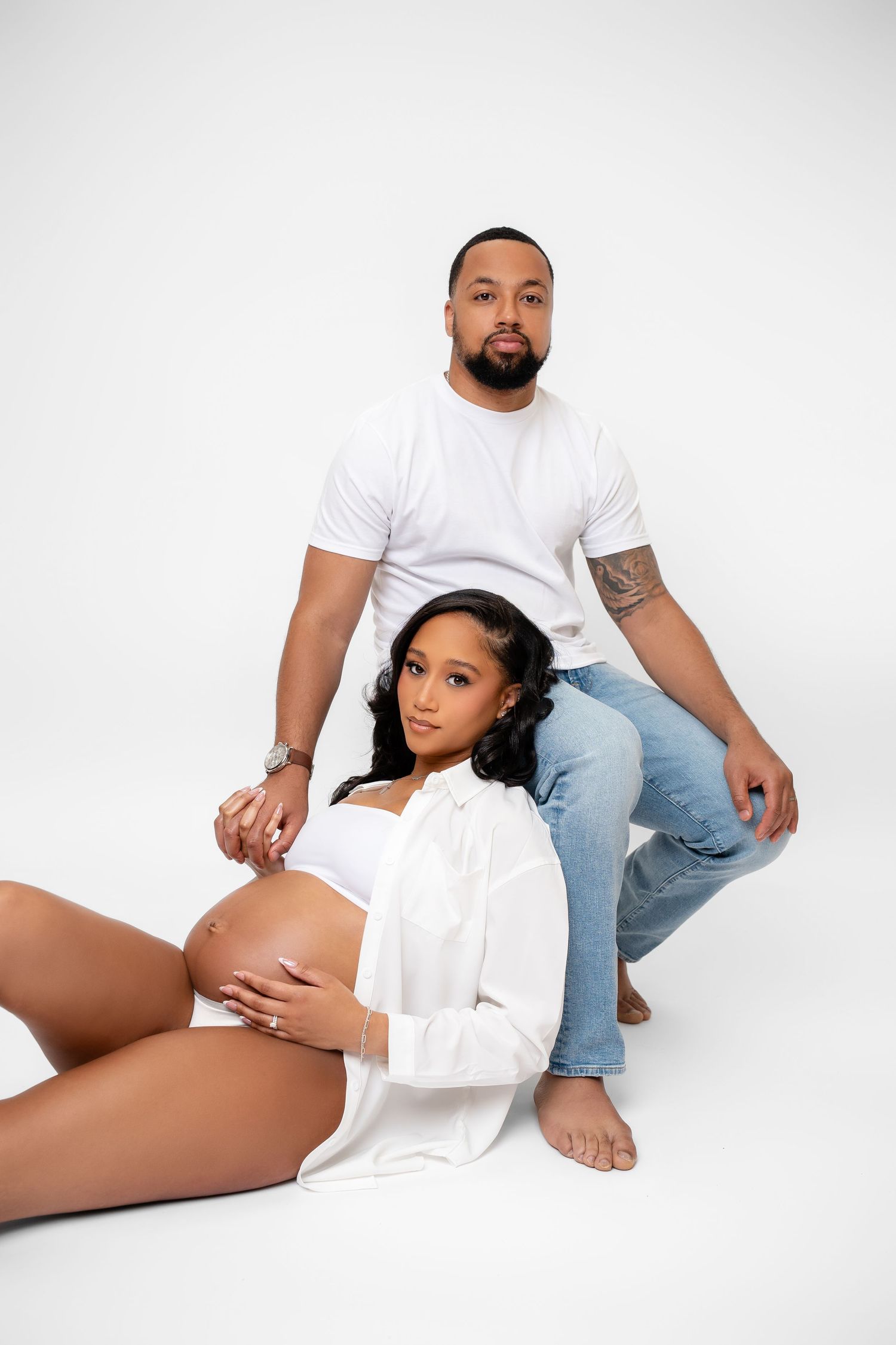 Metro Detroit maternity photographer capturing an expecting couple in studio