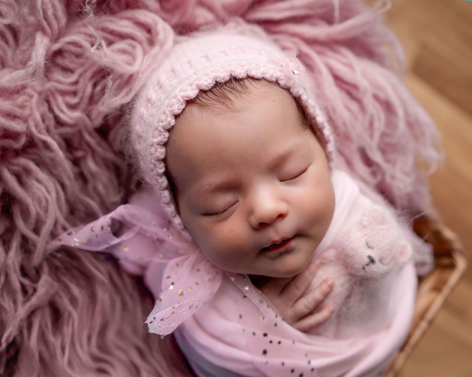 Metro Detroit newborn photographer capturing a peaceful newborn portrait in studio