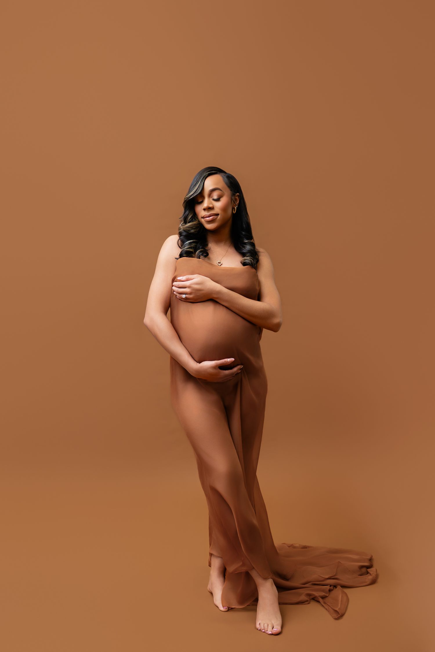 Metro Detroit maternity photographer capturing an expecting mother in studio