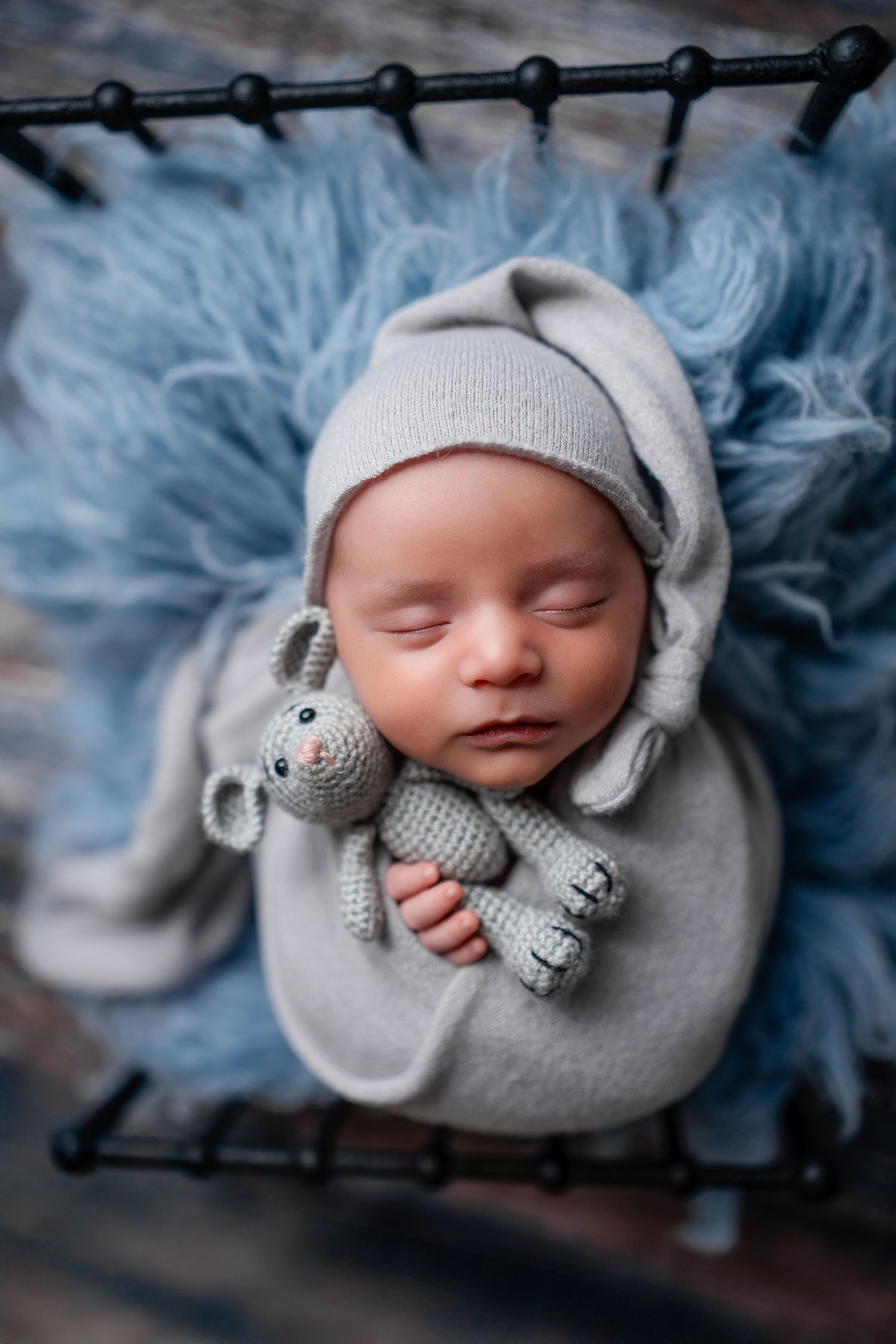 Metro Detroit newborn photographer capturing a peaceful newborn portrait in studio