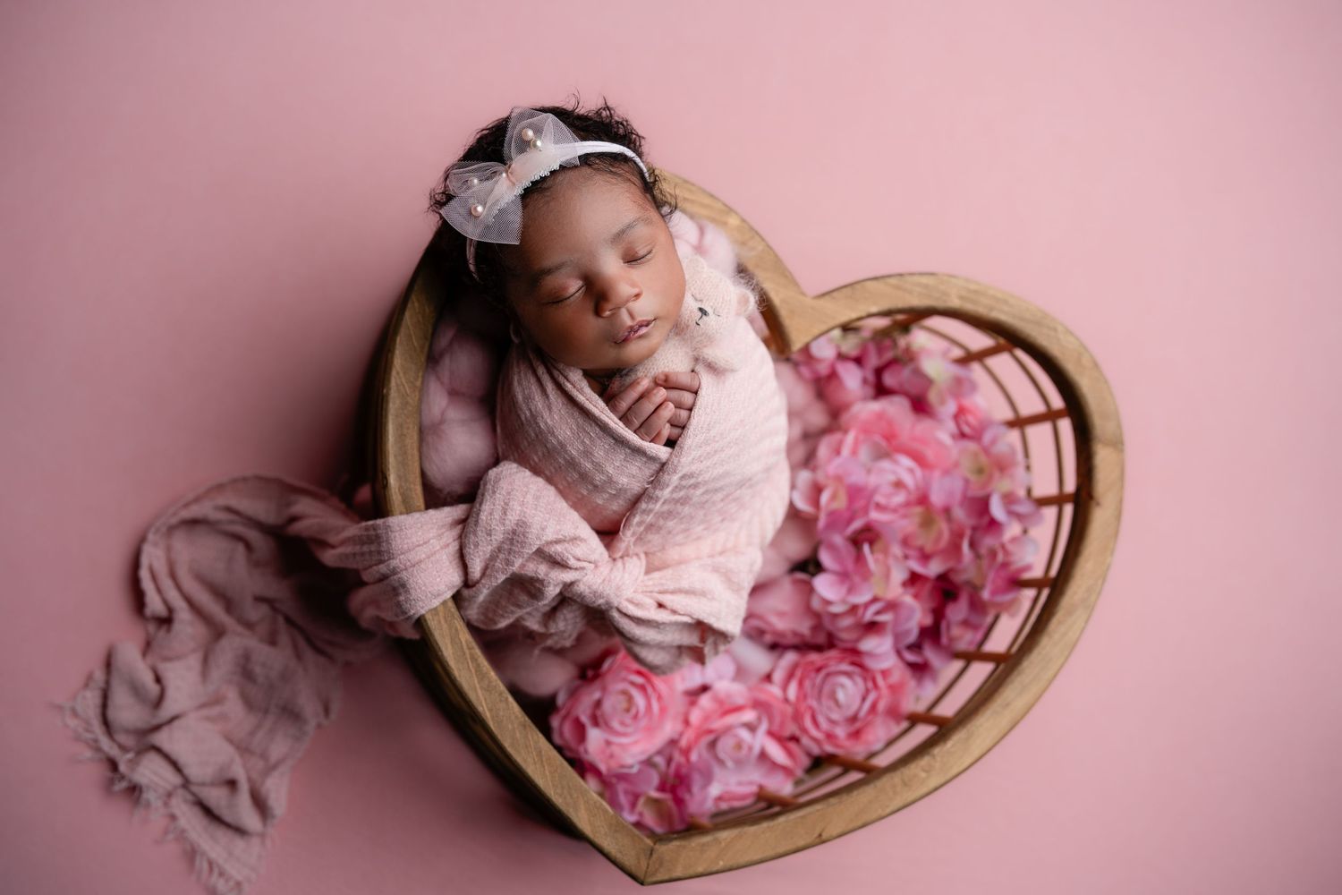Metro Detroit newborn photographer capturing a peaceful newborn portrait in studio
