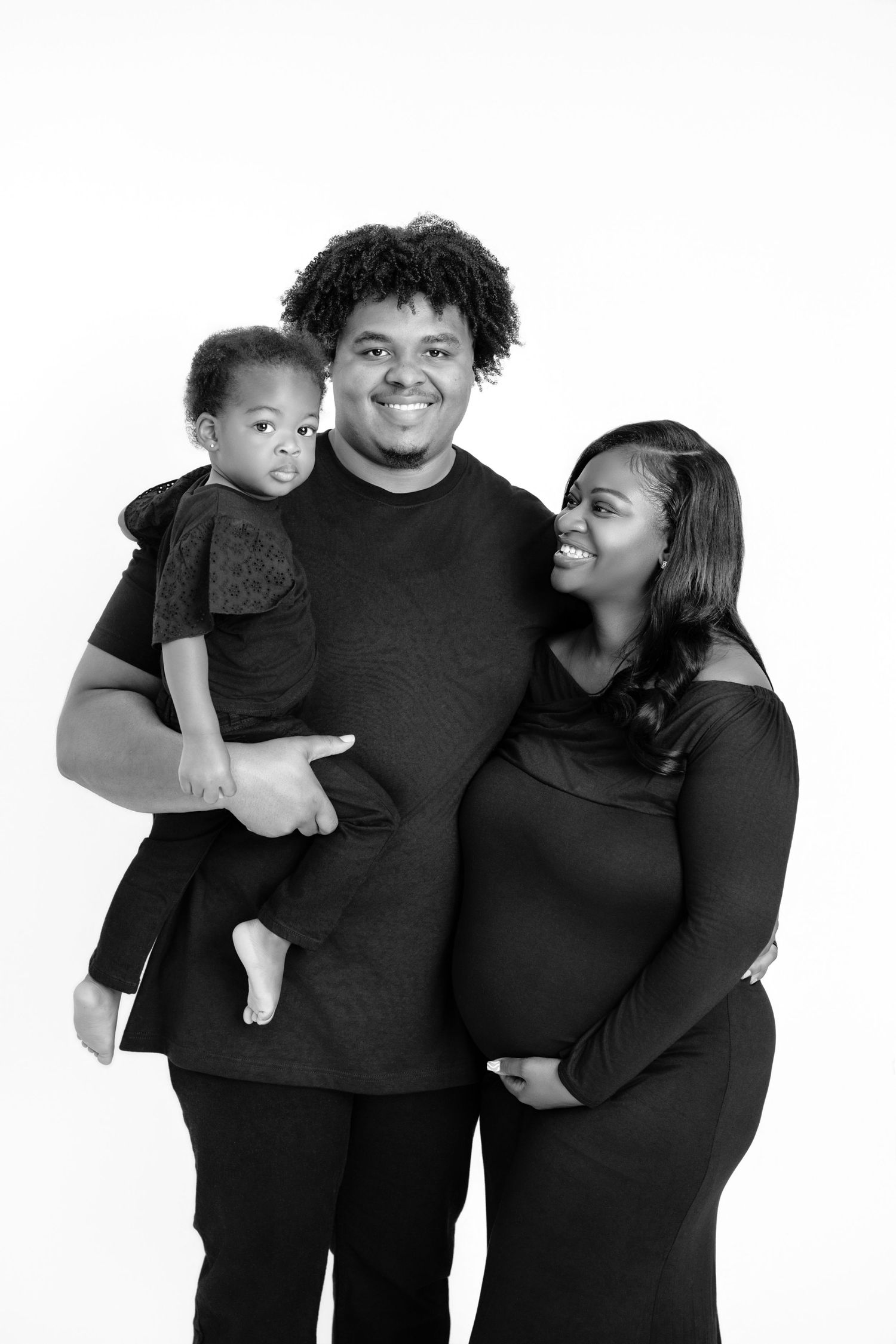 Metro Detroit maternity photographer capturing an expecting mother and family in studio