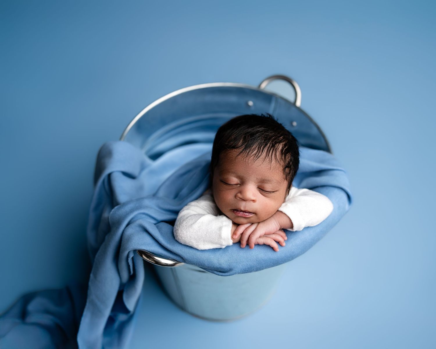 Metro Detroit newborn photographer capturing a peaceful newborn portrait in studio