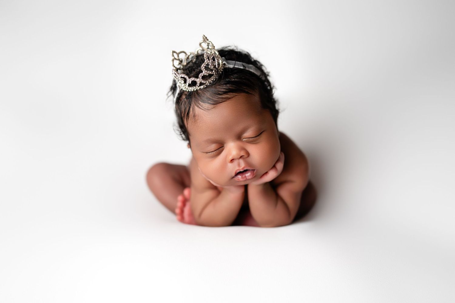 Metro Detroit newborn photographer capturing a peaceful newborn portrait in studio