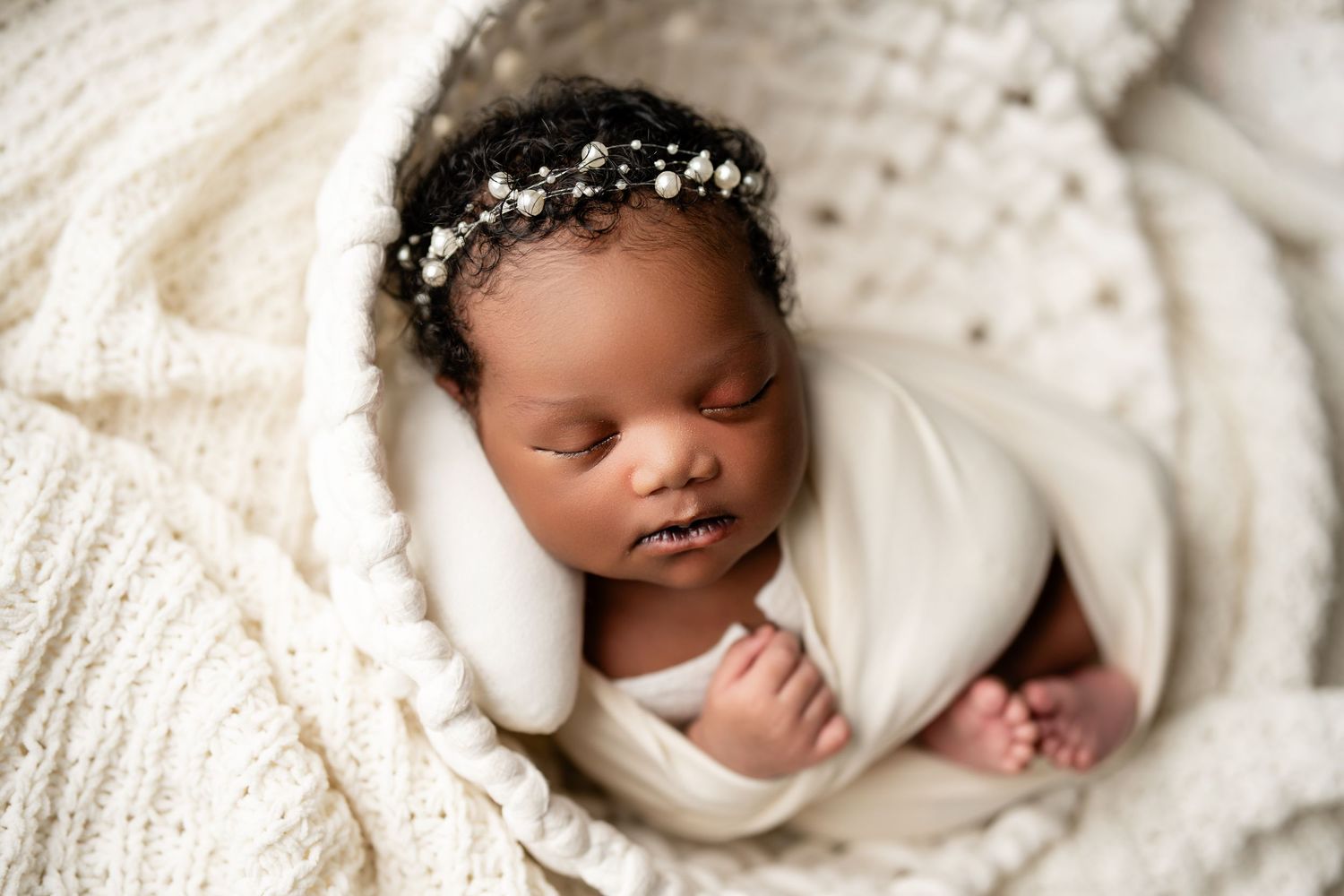 Metro Detroit newborn photographer capturing a peaceful newborn portrait in studio