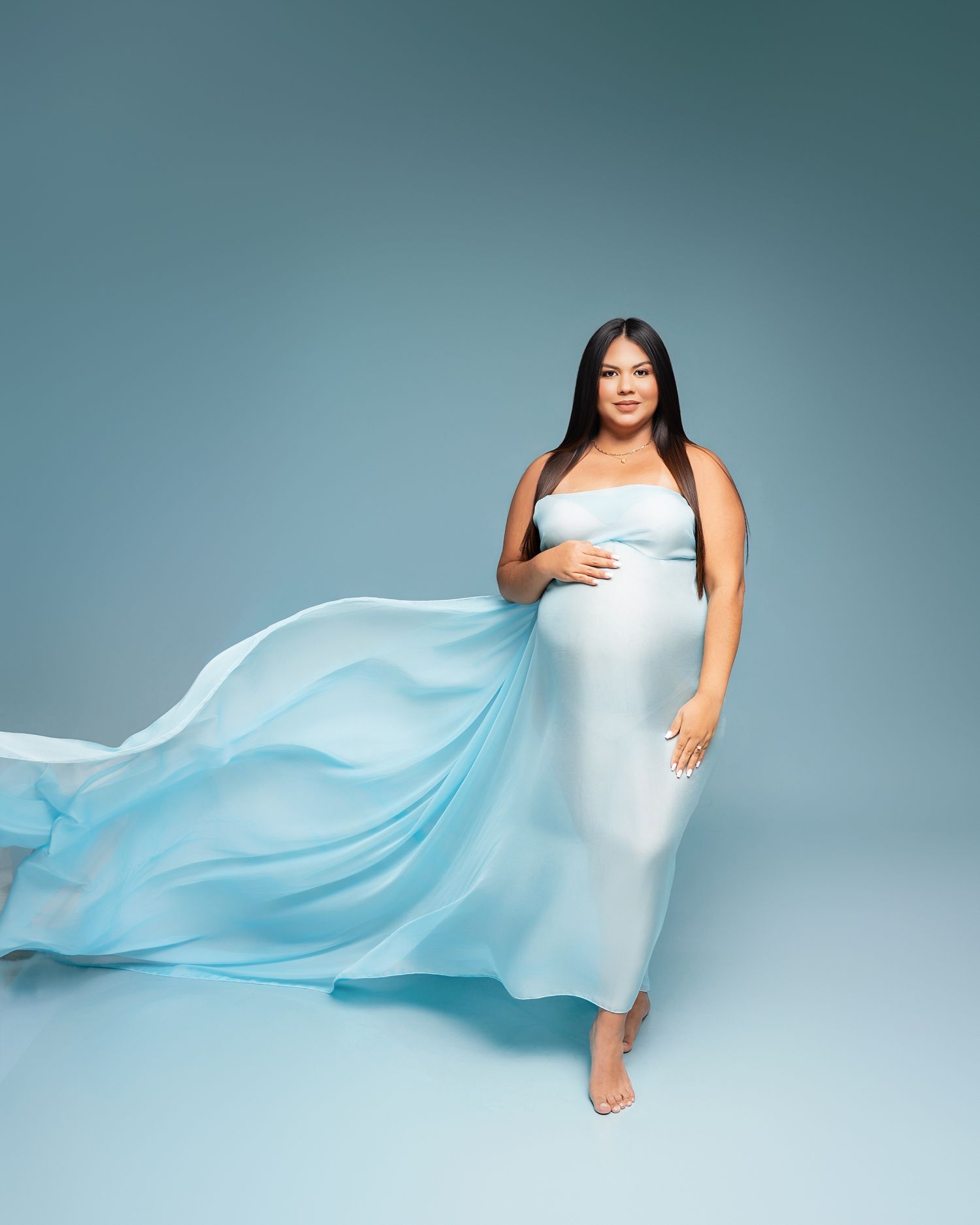 Metro Detroit maternity photographer capturing an expecting mother in studio