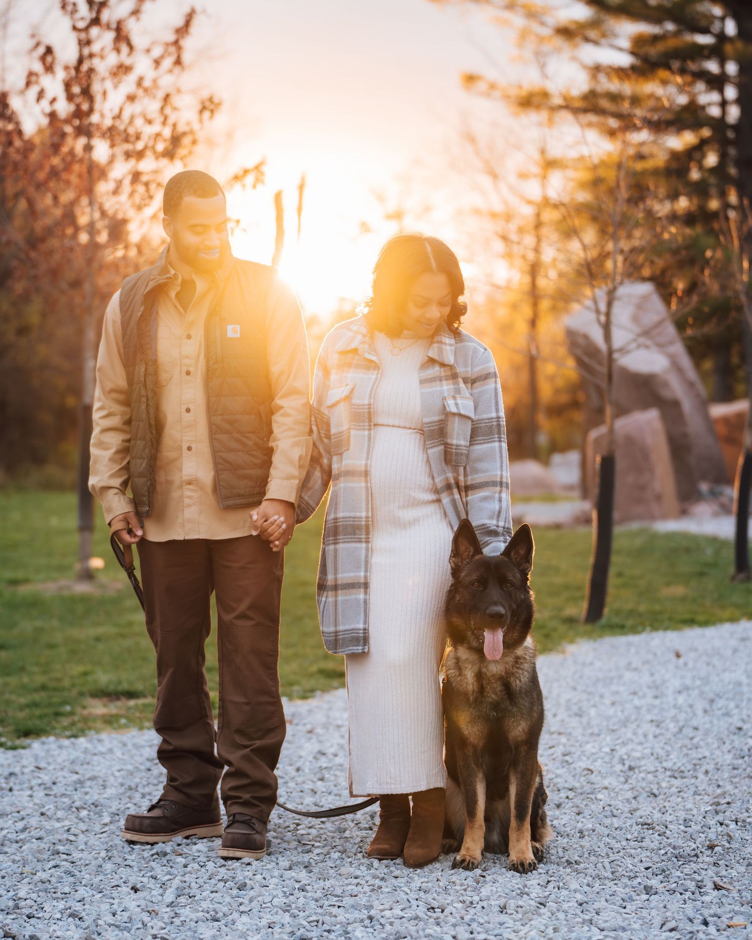 Metro Detroit maternity photographer capturing an expecting A couple during golden hour sunset.