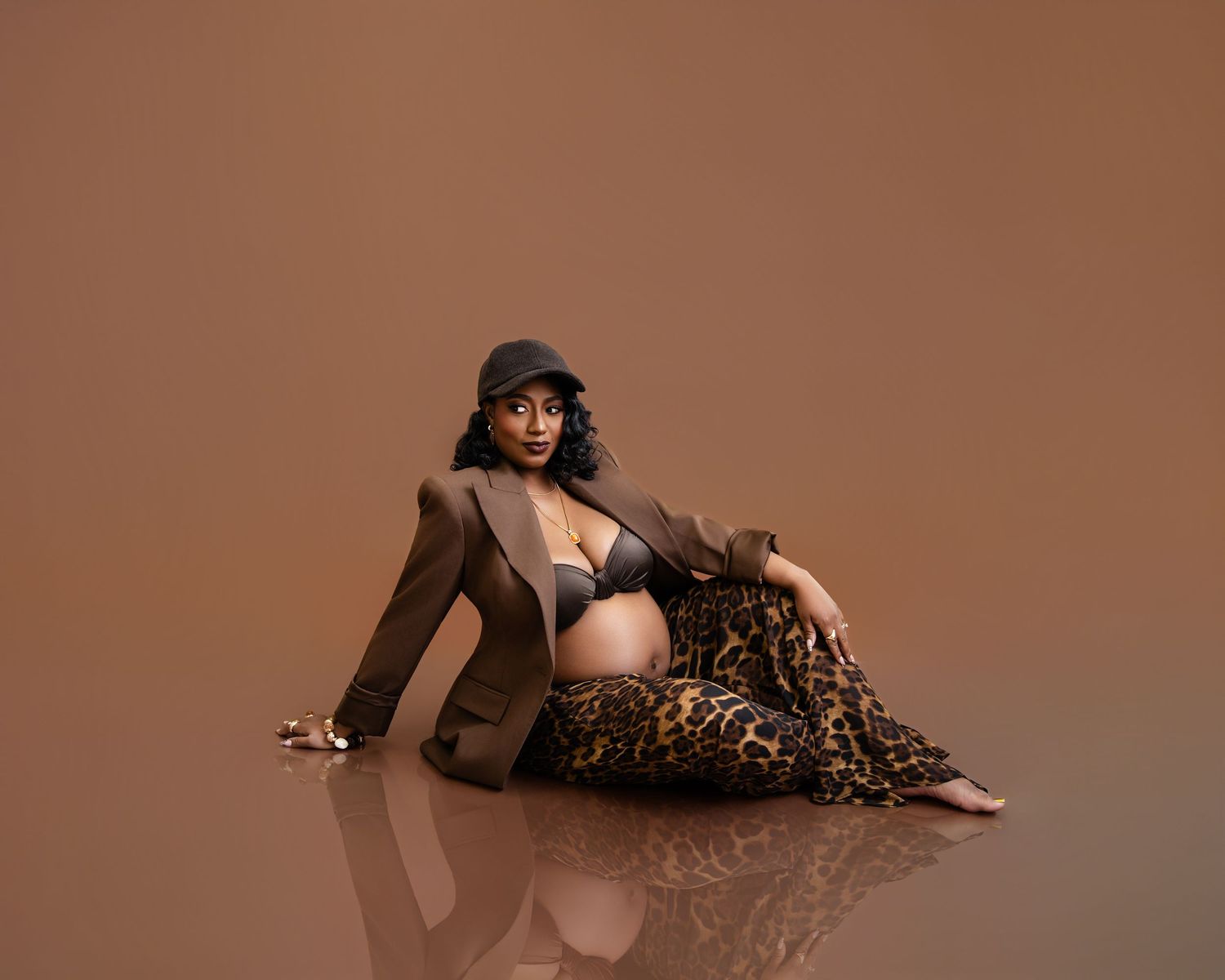 Metro Detroit maternity photographer capturing an expecting mother in studio
