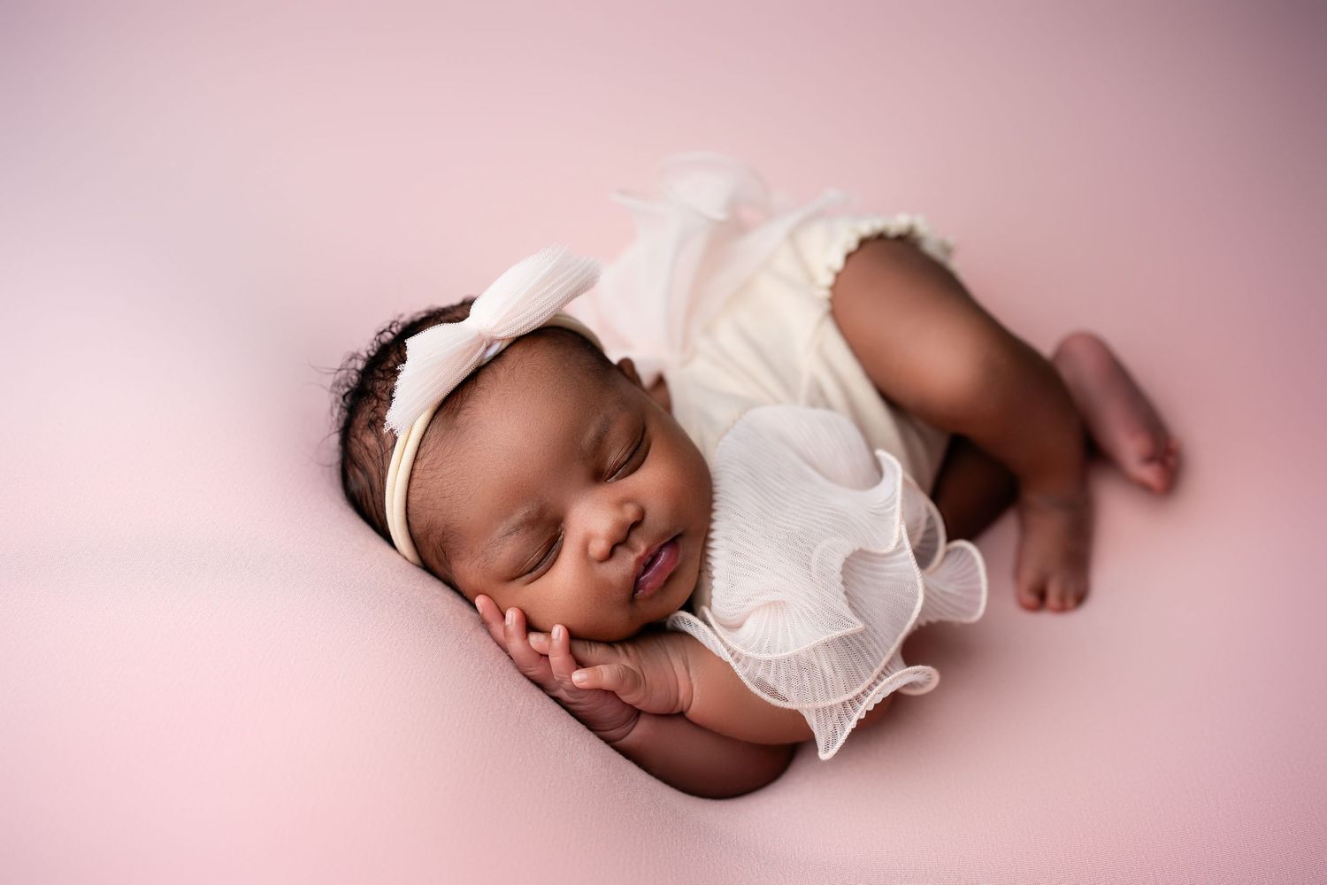 Metro Detroit newborn photographer capturing a peaceful newborn portrait in studio