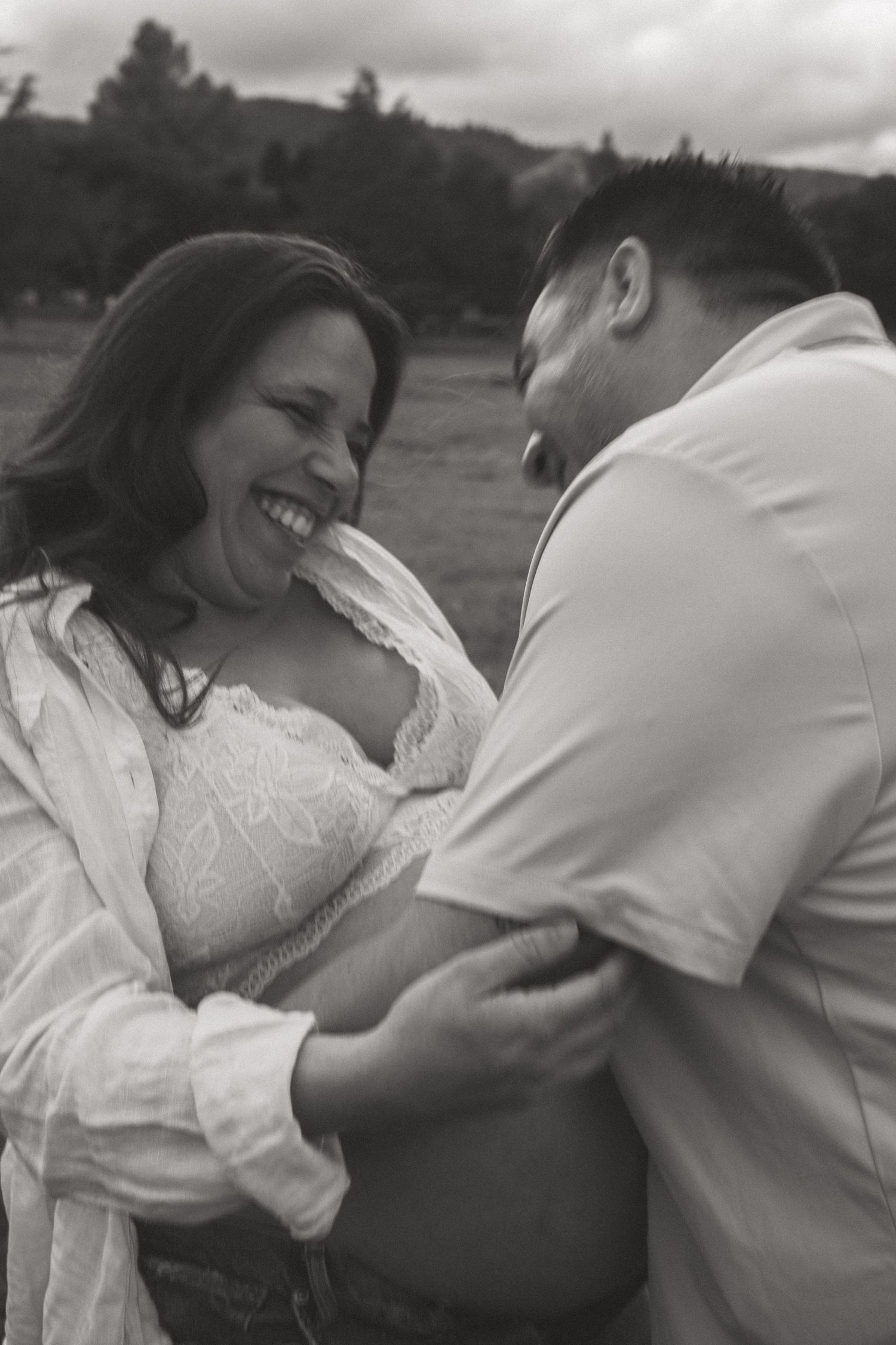 A romantic black and white photo sequence showing a couple embracing in an intimate moment.
