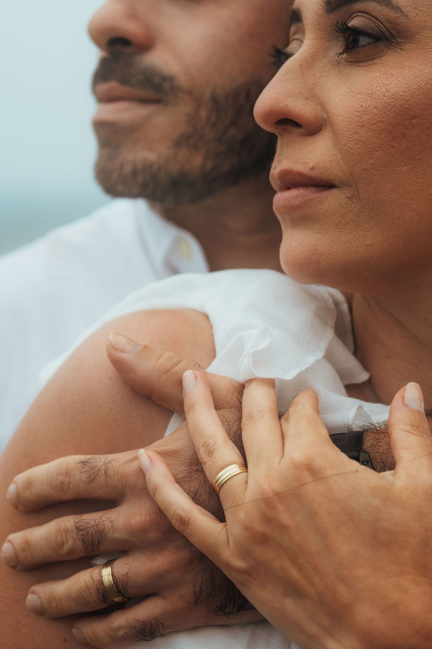 Close-up sequence showing hands and faces of a couple in an intimate moment.