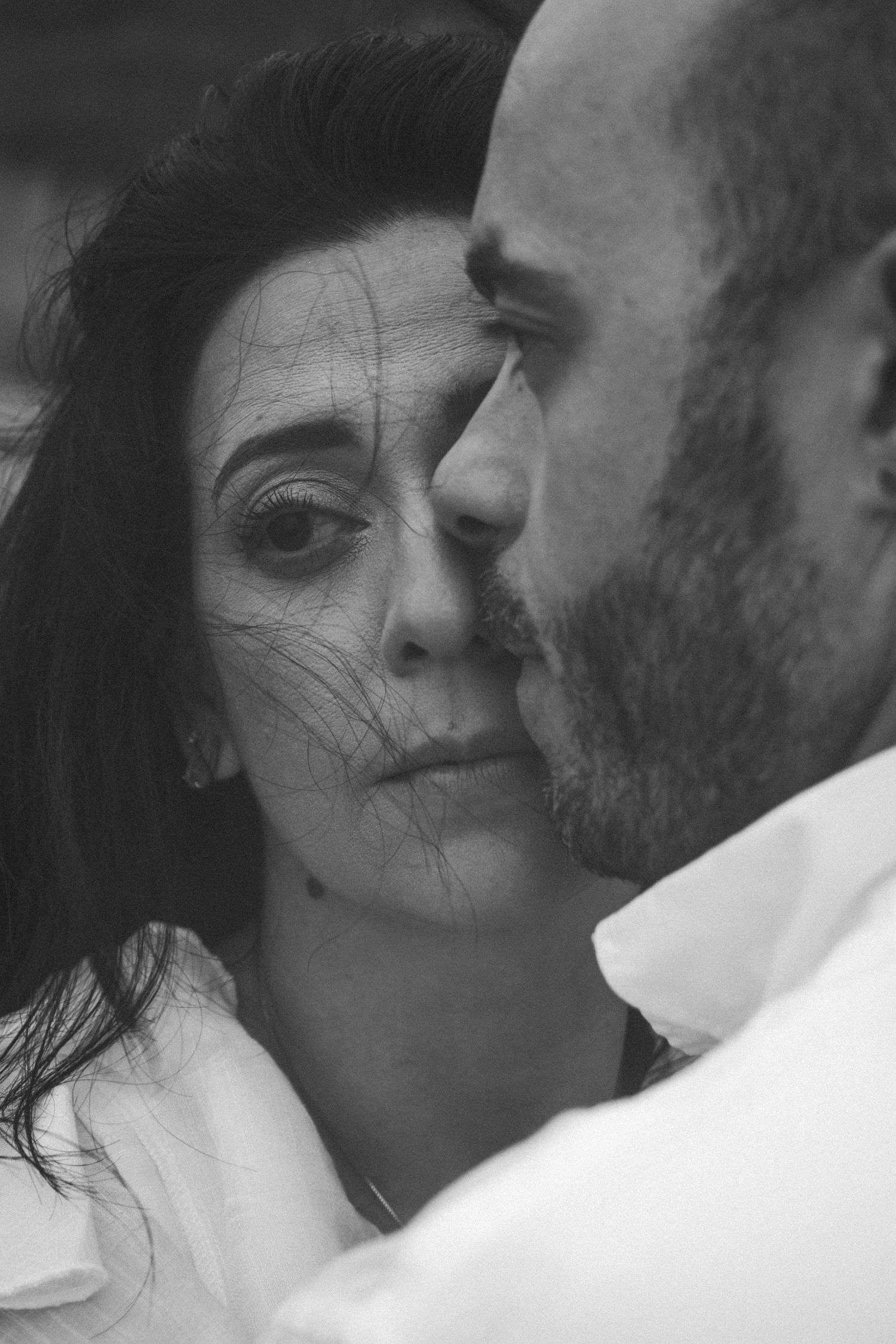 Artistic black and white close-up sequence capturing intimate expressions.