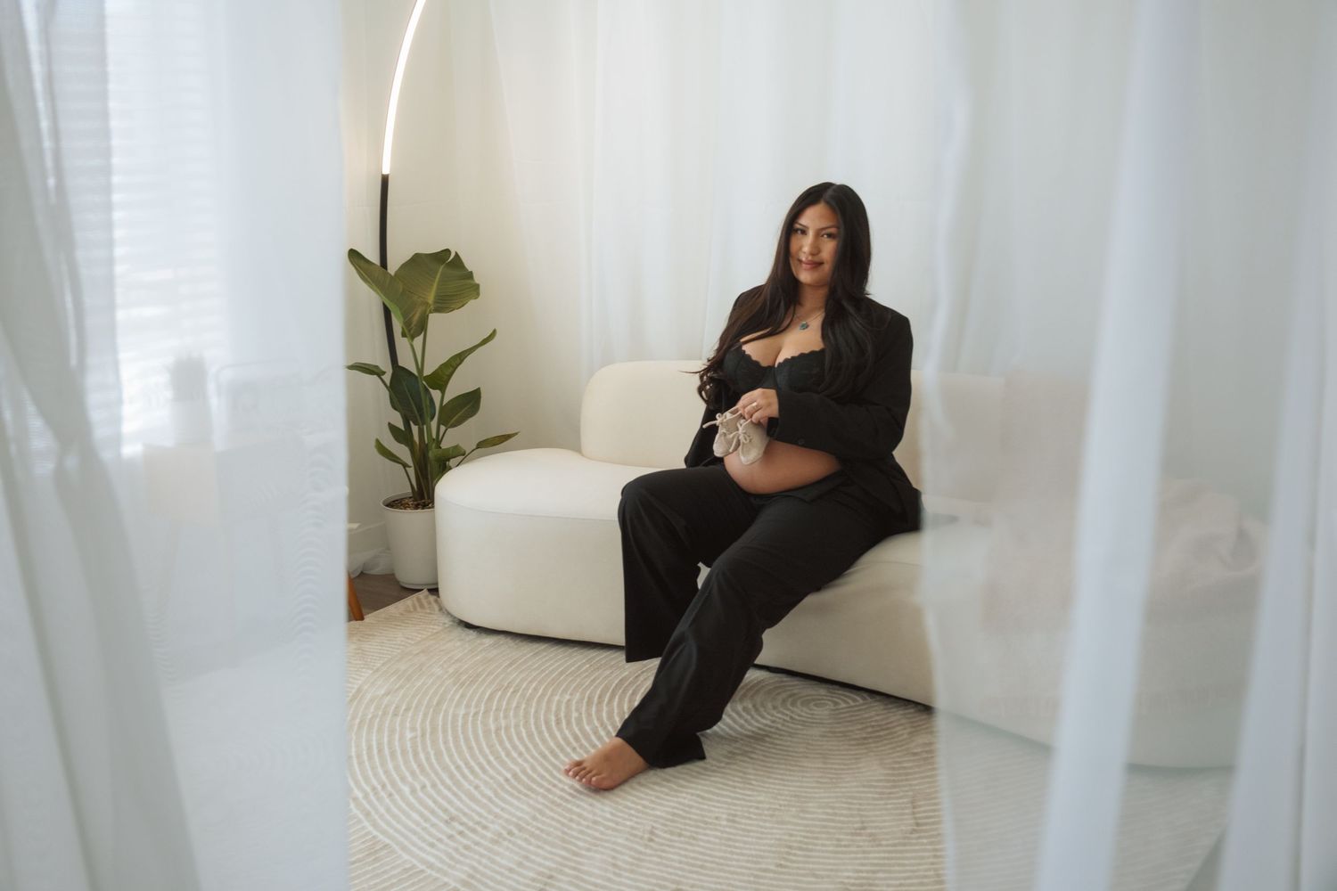 A series of photos showing someone sitting against white walls in different relaxed poses on a light colored floor.