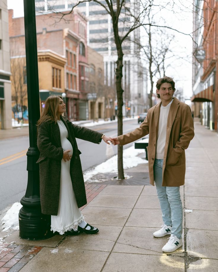Winter street photography session with vintage lampposts and urban architecture.