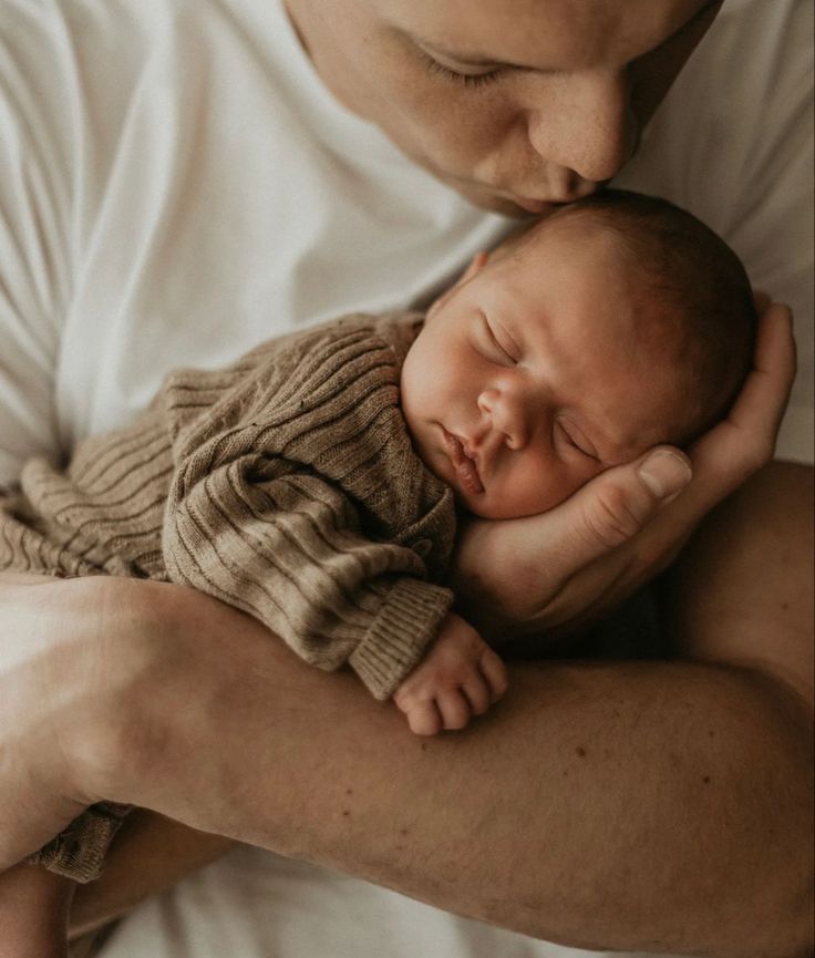 A series of intimate close-up photographs showing a sleeping baby resting peacefully against soft fabric in warm neutral tones.